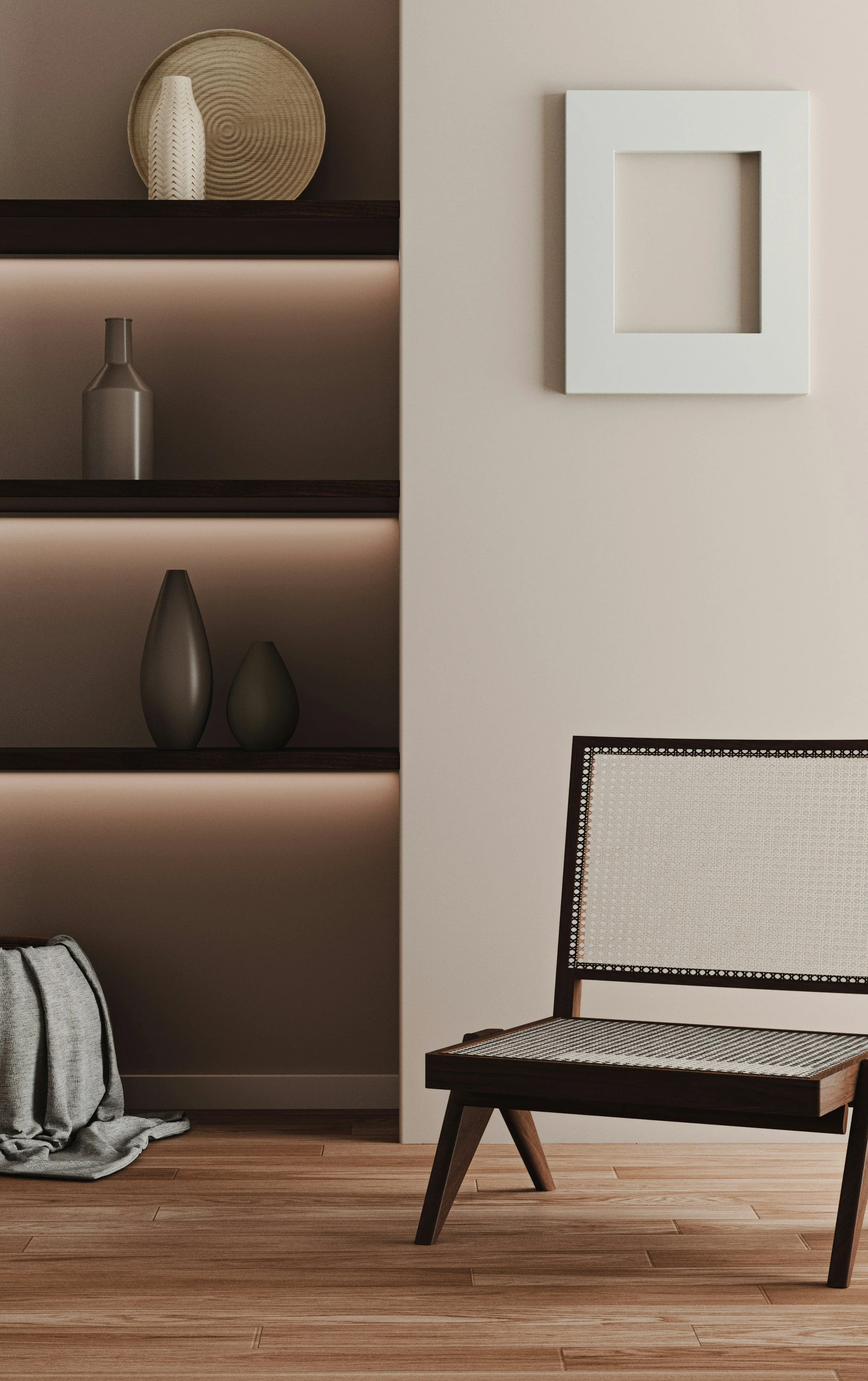 Interior of a modern home showing a wooden chair with a woven backrest, a white wall with a square picture frame, a built-in shelf with decorative vases, and a gray fabric bag on the floor with a blanket.