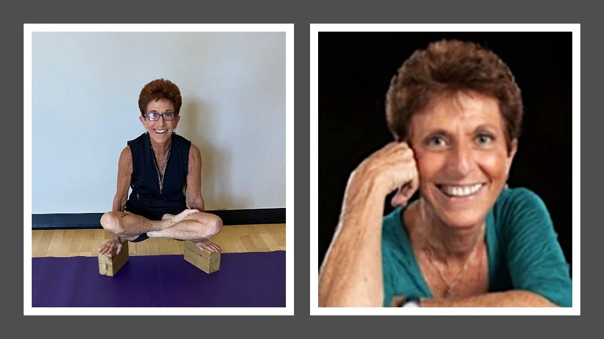 Photograph of a smiling woman with short reddish hair, wearing glasses and black sleeveless top, sitting on a yoga mat with wooden blocks, practicing yoga in a room with a white wall. Another woman with short brown hair, wearing a teal shirt, smiling and resting her head on her hand in a black background.