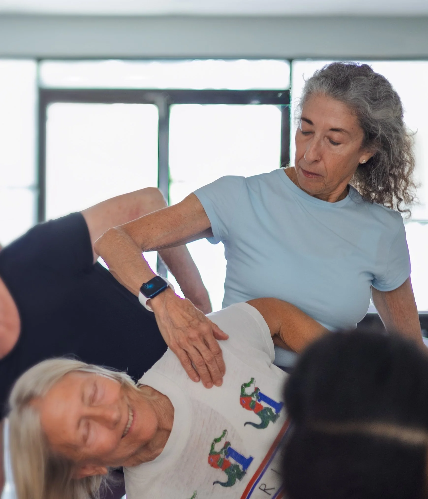 Assisting the movement of the shoulder to improve Utthita Trikonasana