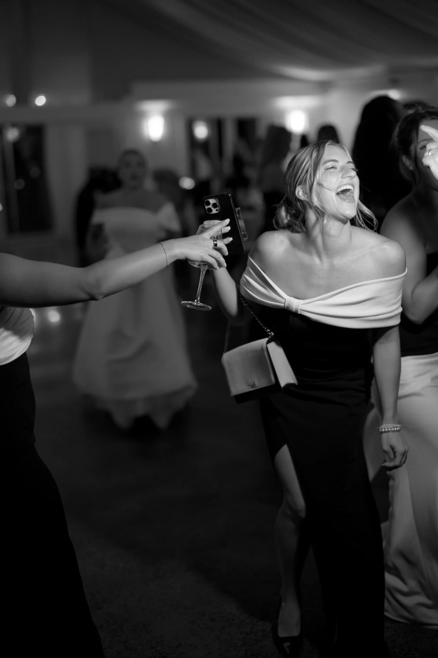 Guest laughing on a packed dance floor