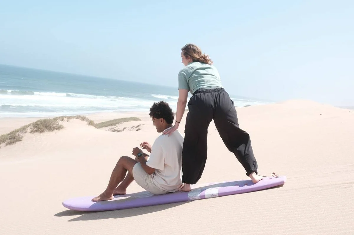 Sandboarding on dunes near Mirleft in South Morocco