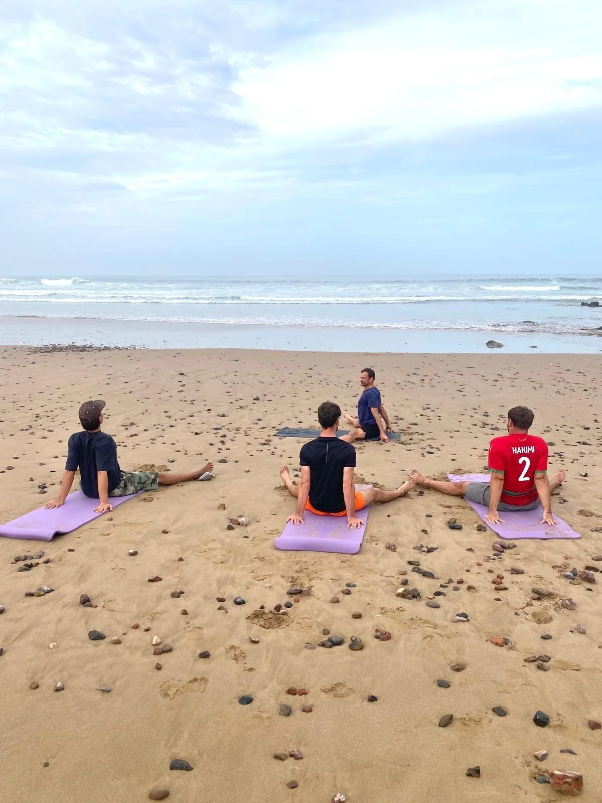 Yoga session overlooking at the Atlantic coast in Mirleft