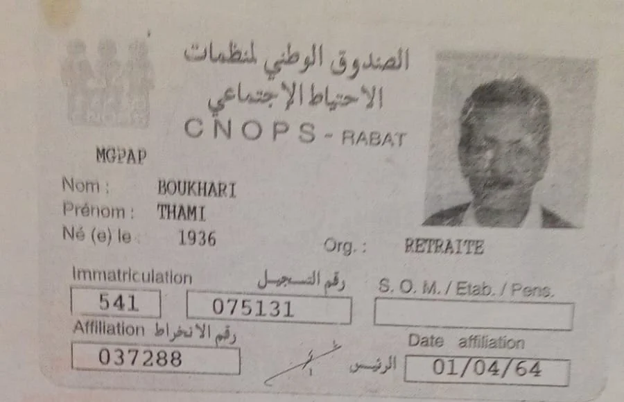 Old Moroccan national ID card with a photo of a man, text in Arabic and French, including name Thami Boukhari, born in 1936, issued in Rabat on April 1, 1964.
