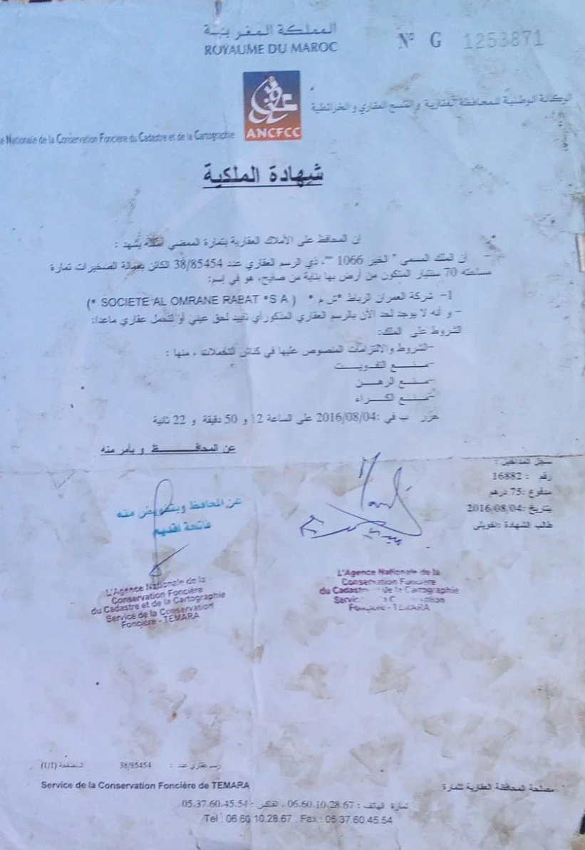 A Moroccan official land ownership certificate issued by the Royal Moroccan Land Registry, containing signatures, official seals, Arabic text, and the logo of ANFCC.