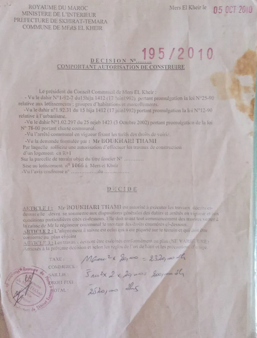 Official document from Morocco's Ministry of Interior, dated October 5, 2010, approving construction authorization for a property in Mers El Kheir. Contains legal references and a handwritten calculation for costs.