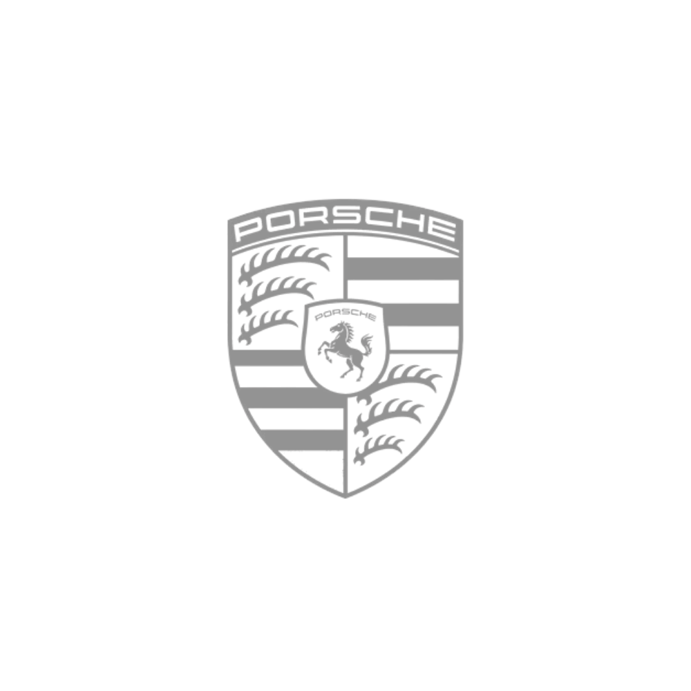 A black and white image featuring the Porsche crest logo, which includes a shield with a prancing horse and the word 'Porsche' at the top.