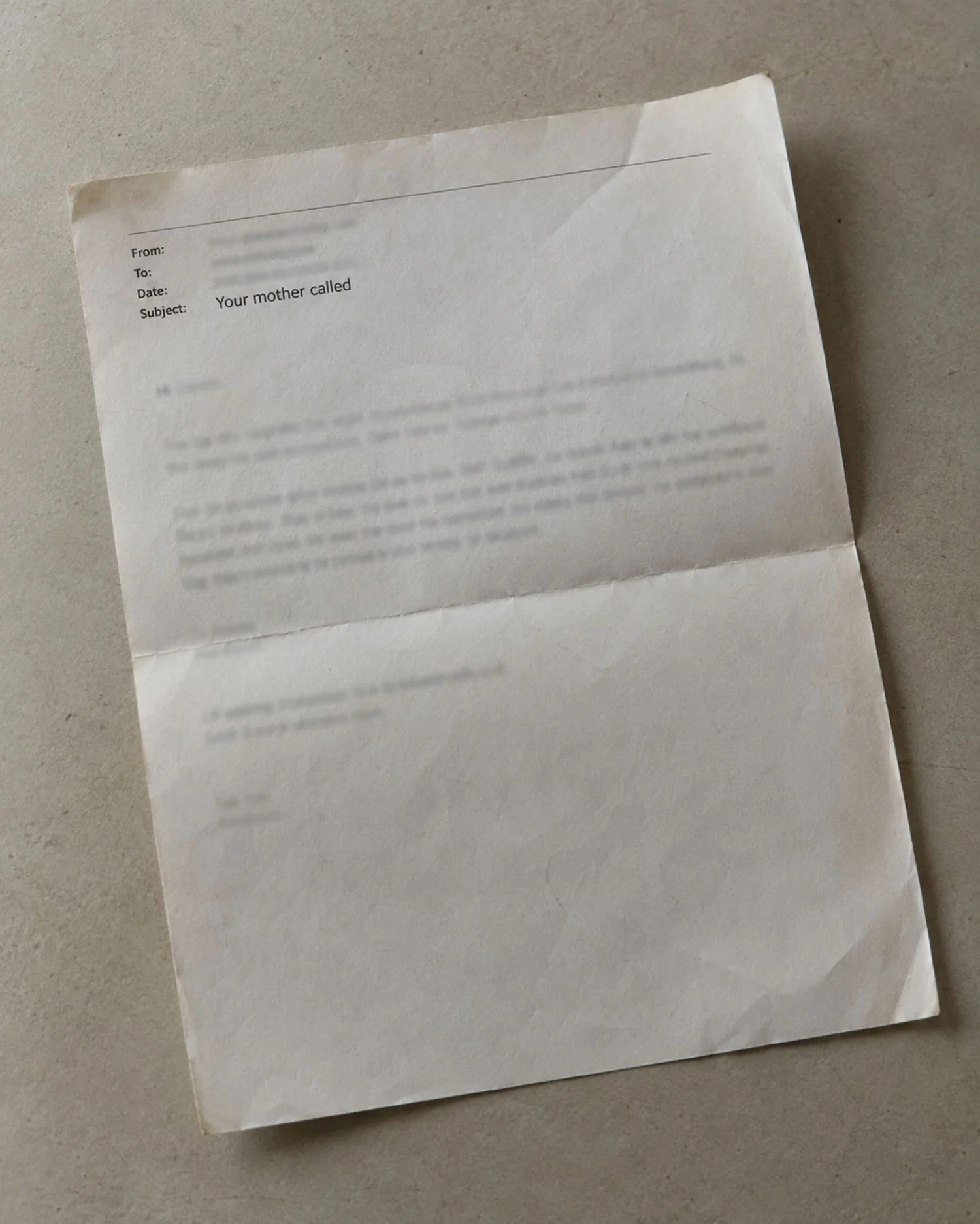 An old printed email on white paper.