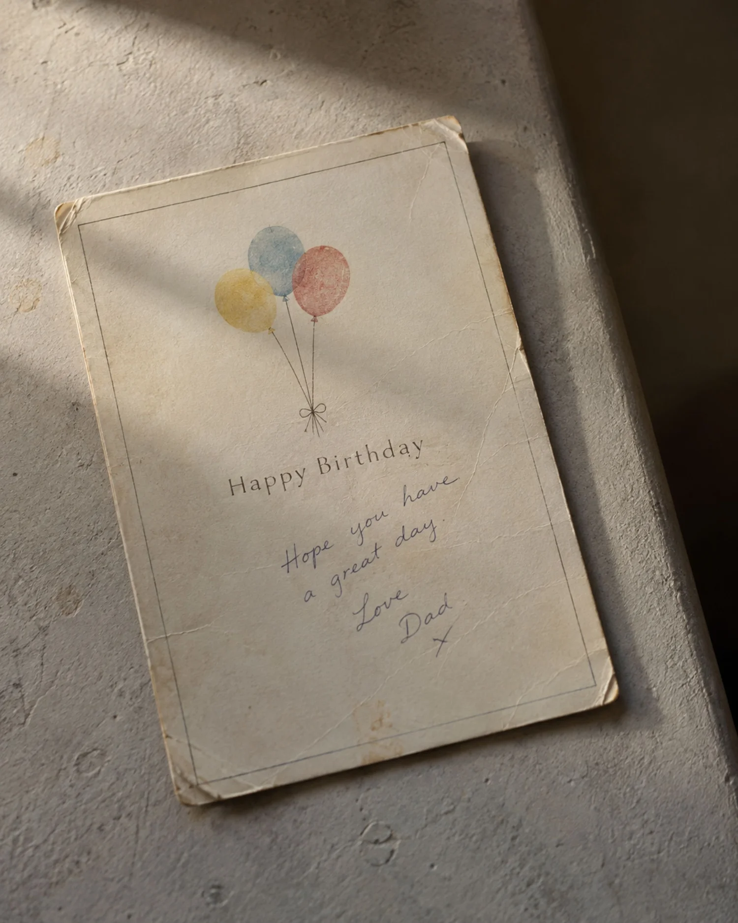 A worn birthday card kept for many years.