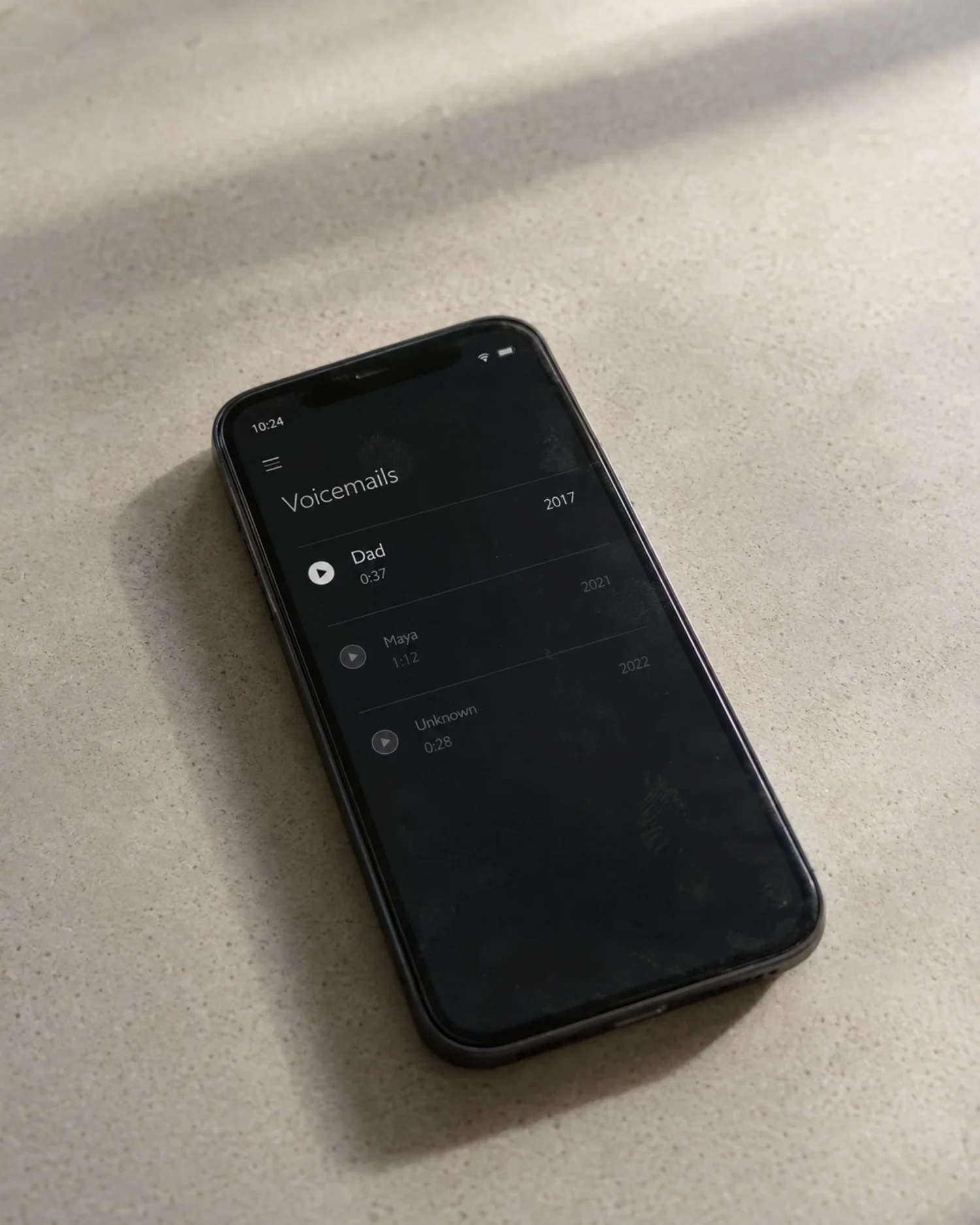 A phone displaying a saved voicemail dated 2017.