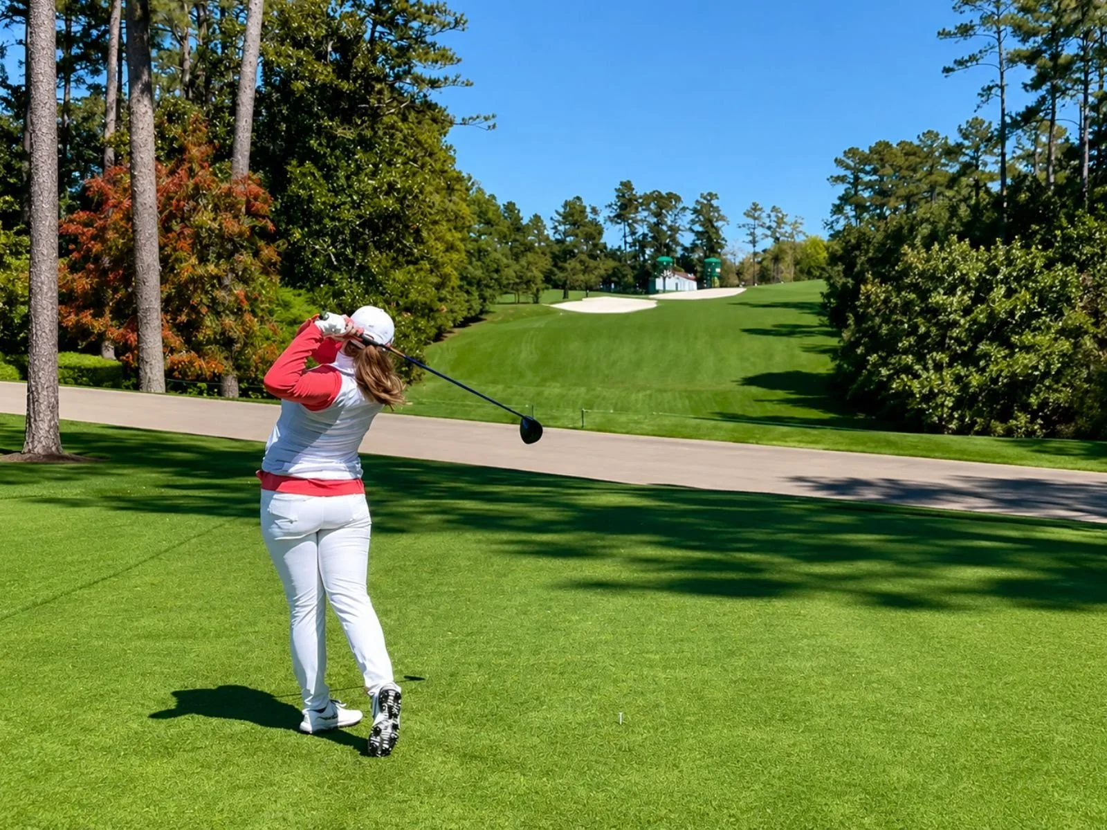Addie playing golf as an adult