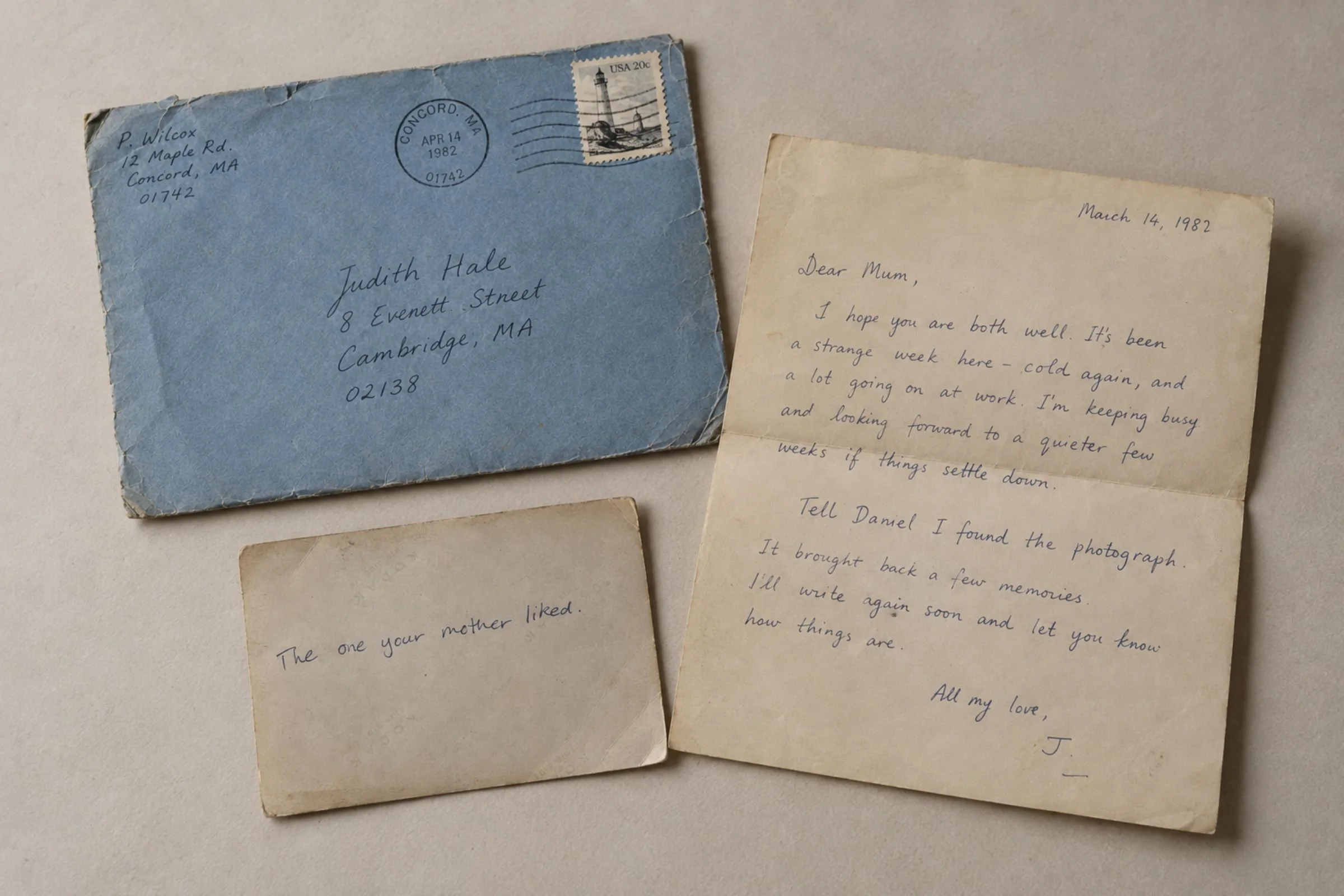 The blue envelope, handwritten letter and photograph brought together as one archival thread.