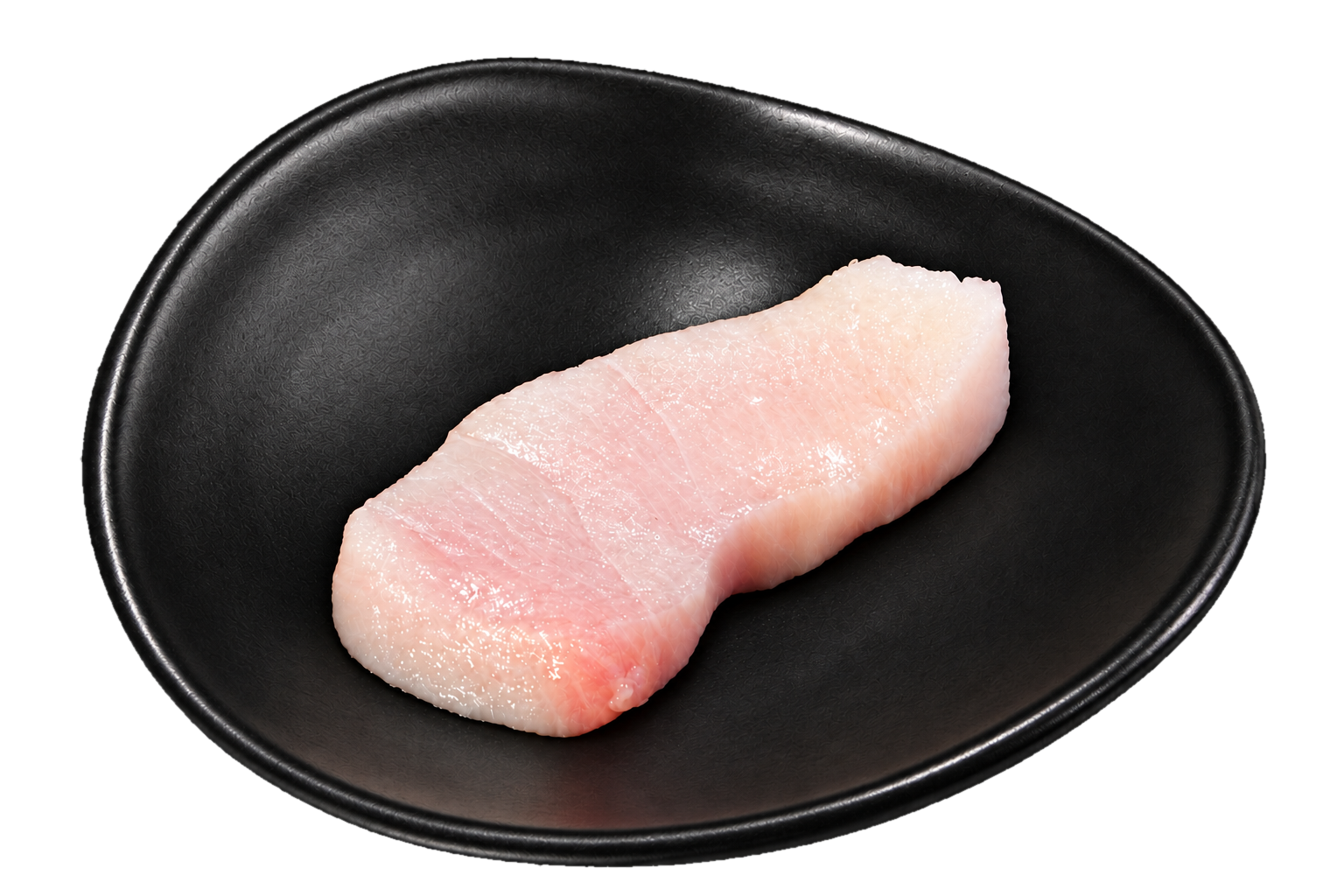 A raw piece of fish, likely a fillet, on a black oval plate.