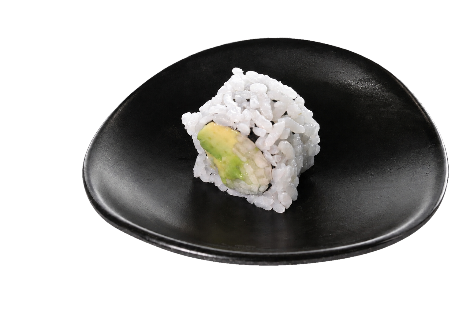 A single piece of sushi roll with rice on the outside, containing avocado, on a black plate.
