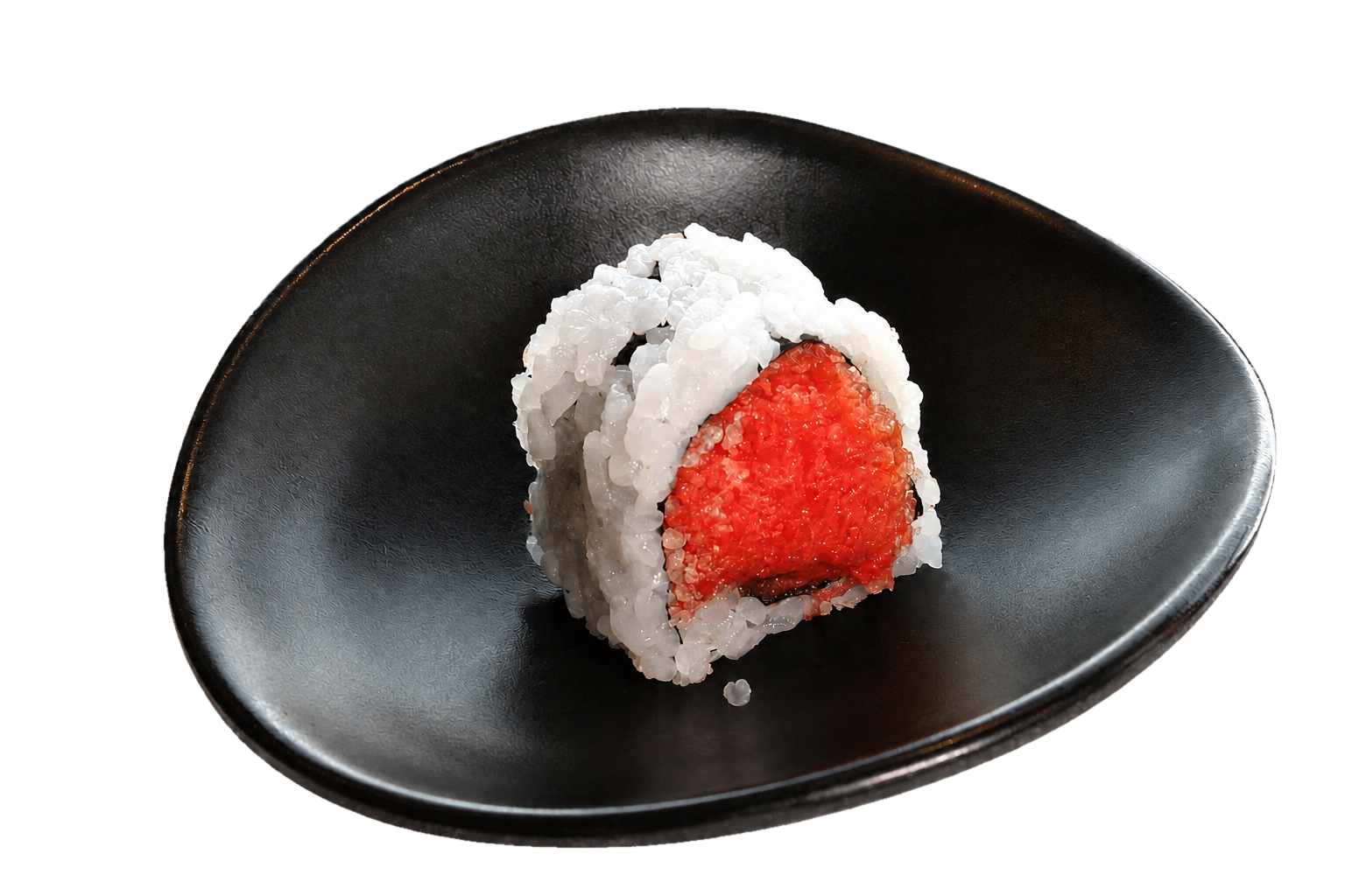 A sushi roll with white rice and red fish inside, served on a black dish.
