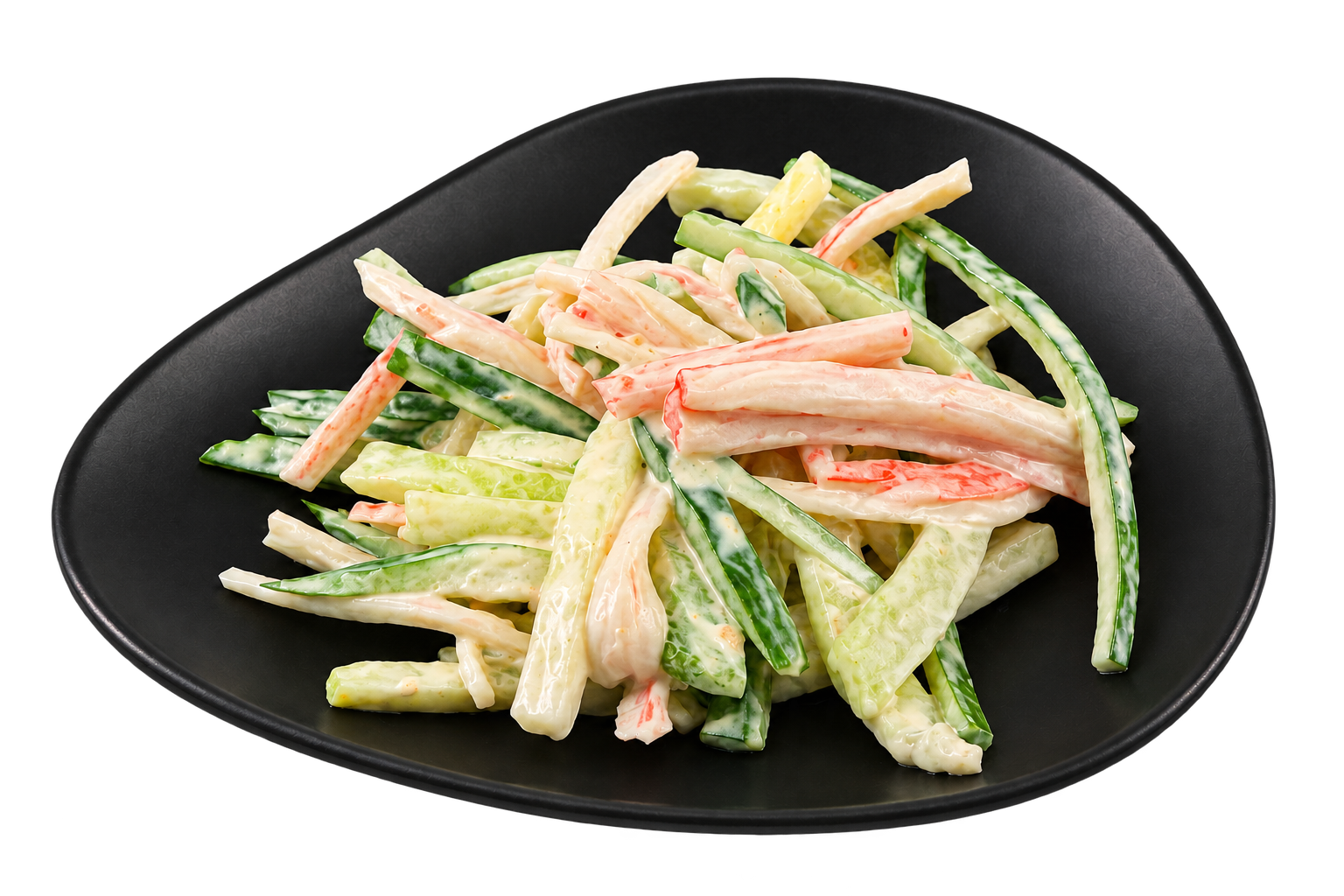 A black plate containing a creamy cucumber and crab stick salad with julienned vegetables.