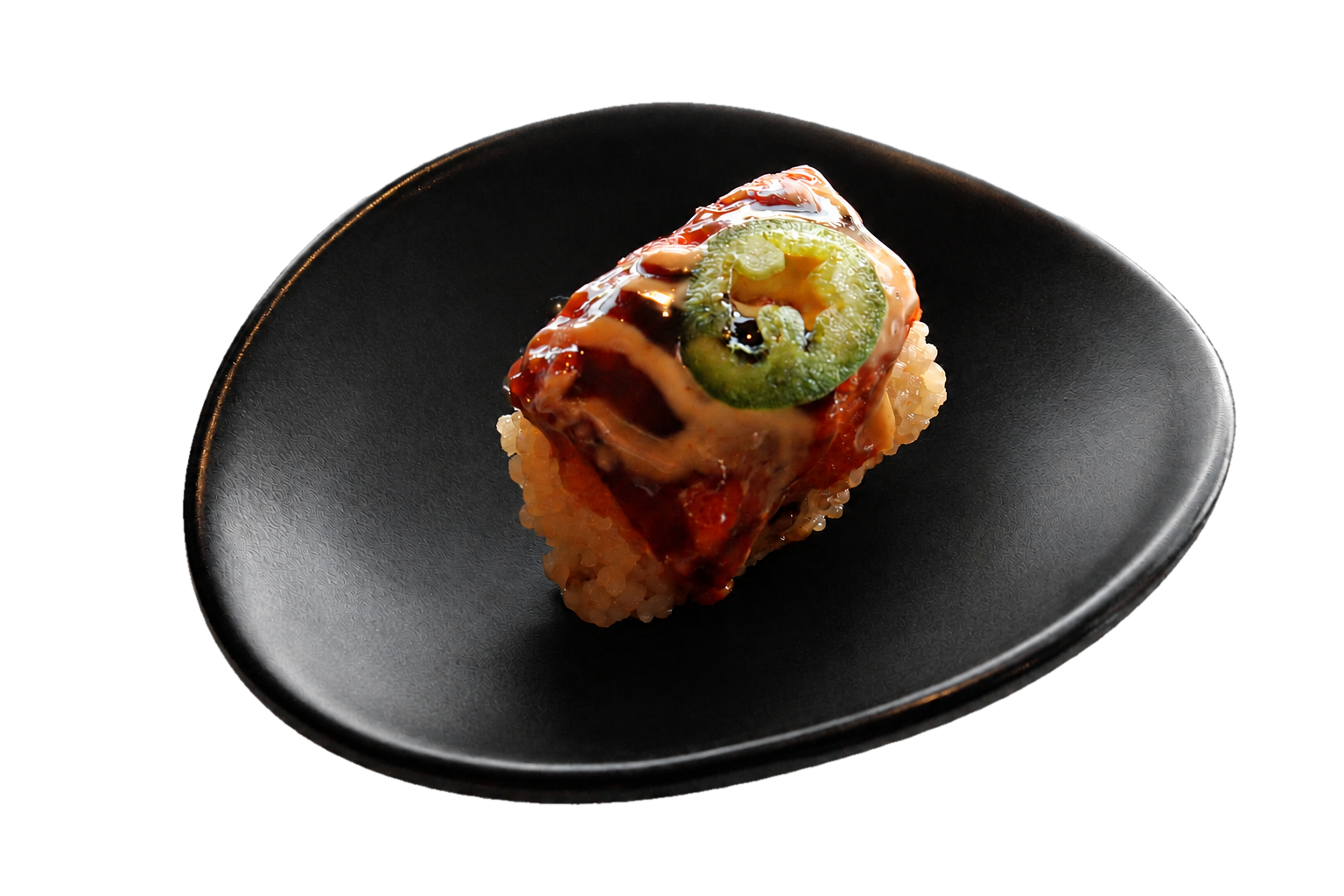 A piece of sushi with rice, topped with a slice of cucumber, sauce, and a drizzle of mayonnaise on a black plate.