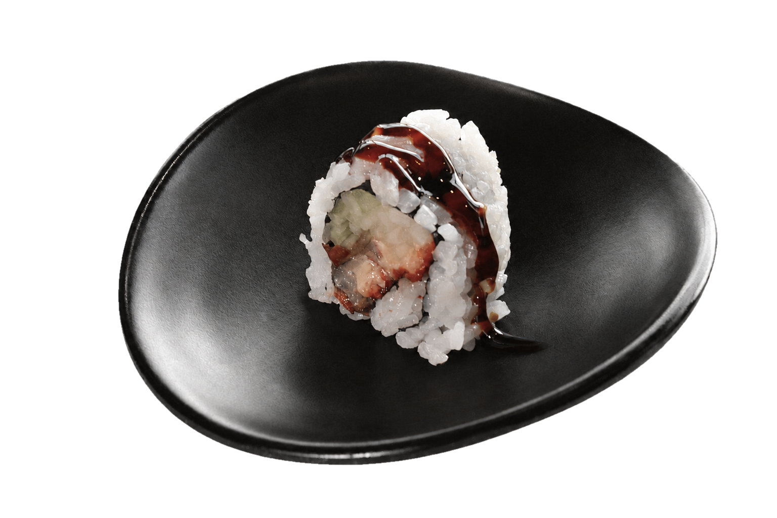 A piece of sushi with rice, fish, cucumber, and sauce on a black plate.