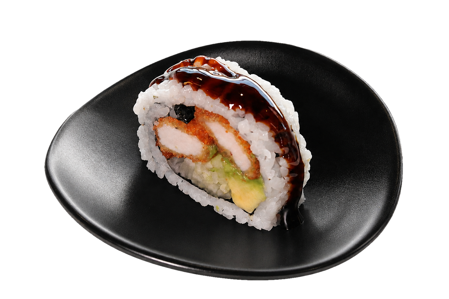 A piece of sushi roll with cooked chicken, avocado, and rice, topped with eel sauce on a black plate.