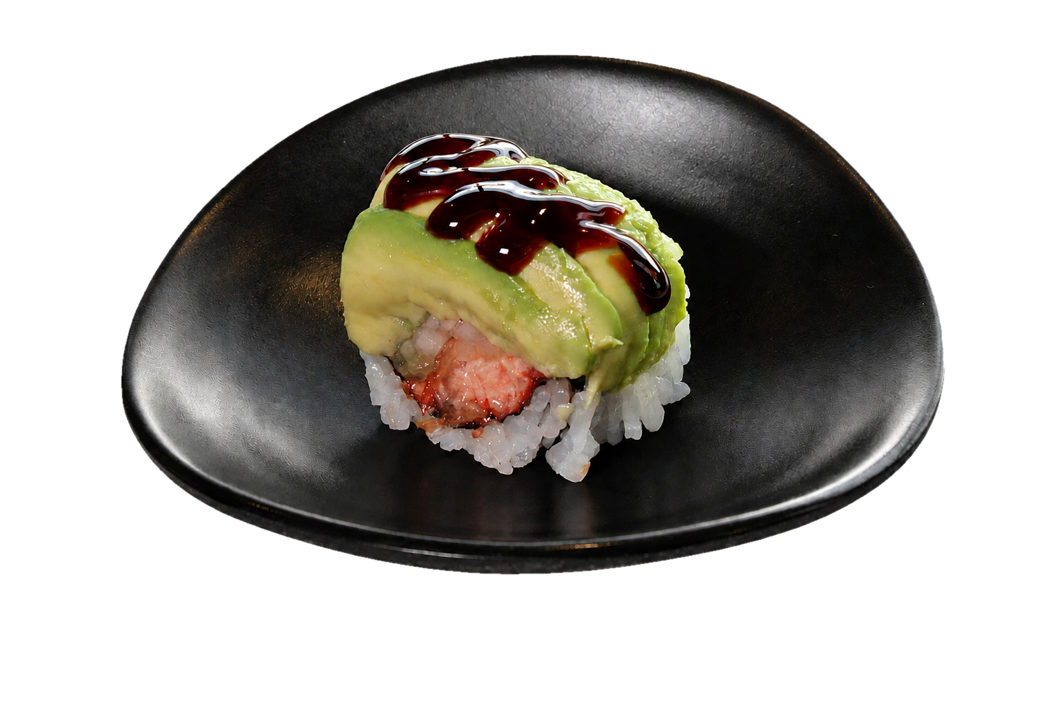 Single sushi roll topped with avocado slices and drizzled with dark sauce on a black plate.
