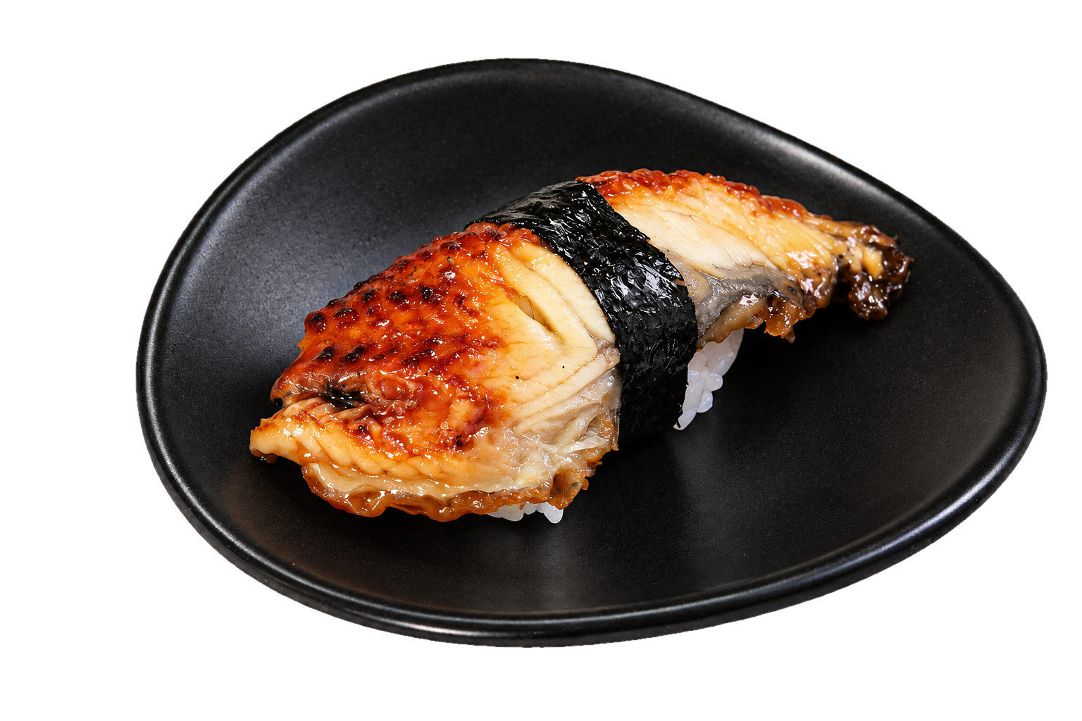 A piece of sushi with eel and rice on a black plate.