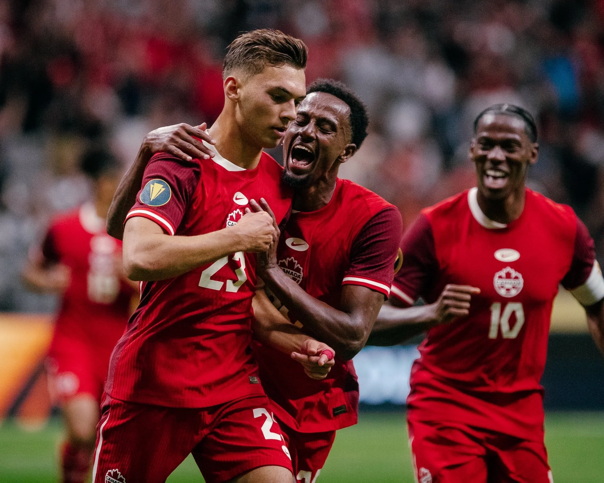Beau Chevalier photo of Ali Ahmed and Niko Sigur celebrating goal for Canada Soccer at BC Place against Honduras in the 2025 Gold Cup