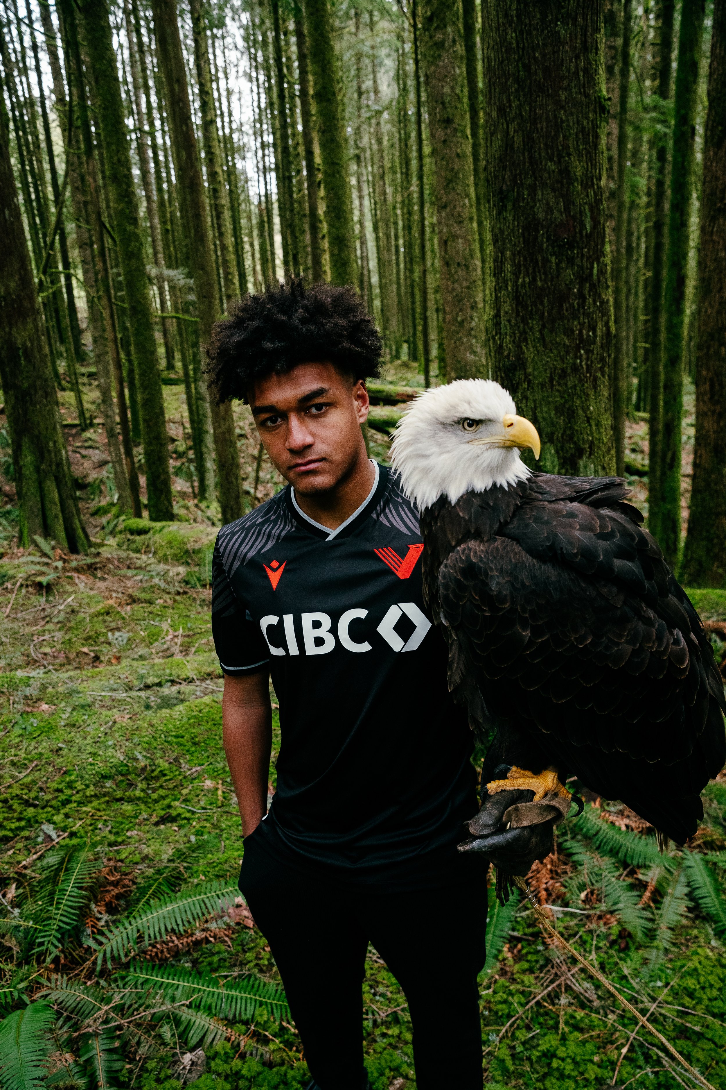 	
Beau Chevalier photo of Canada Soccer player TJ Tahid in Vancouver posing with Eagle for Vancouver FC 2024 Eagle Kit