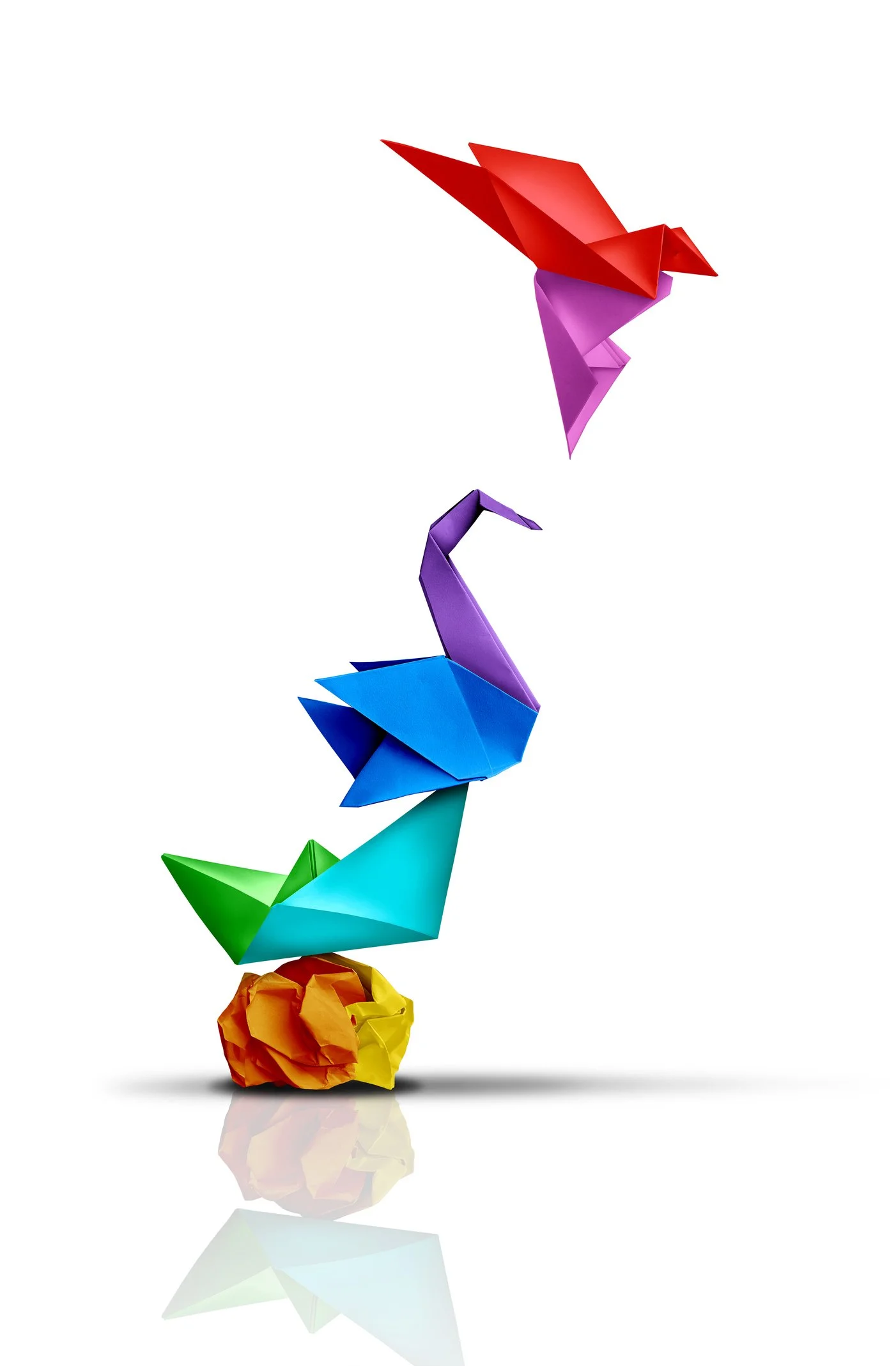 Colorful origami animals stacked in a vertical line, starting with a red bird, followed by purple, blue, green, and orange paper balls, all on a reflective surface.