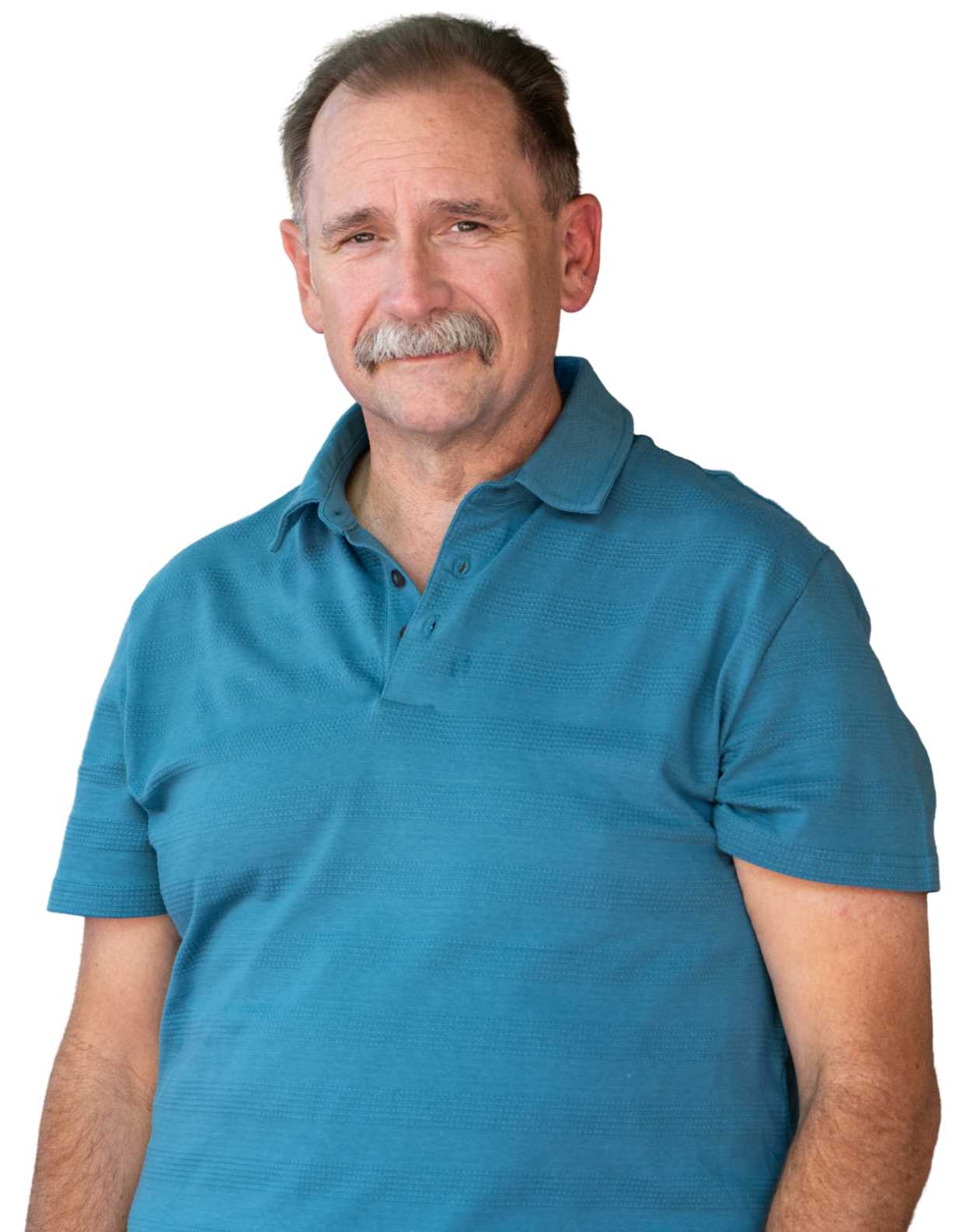 A middle-aged man with gray hair and mustache wearing a blue polo shirt, standing and making a skeptical or confused expression.
