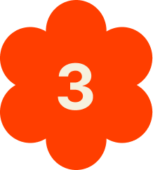 Orange flower-shaped sign with the number 3 in white