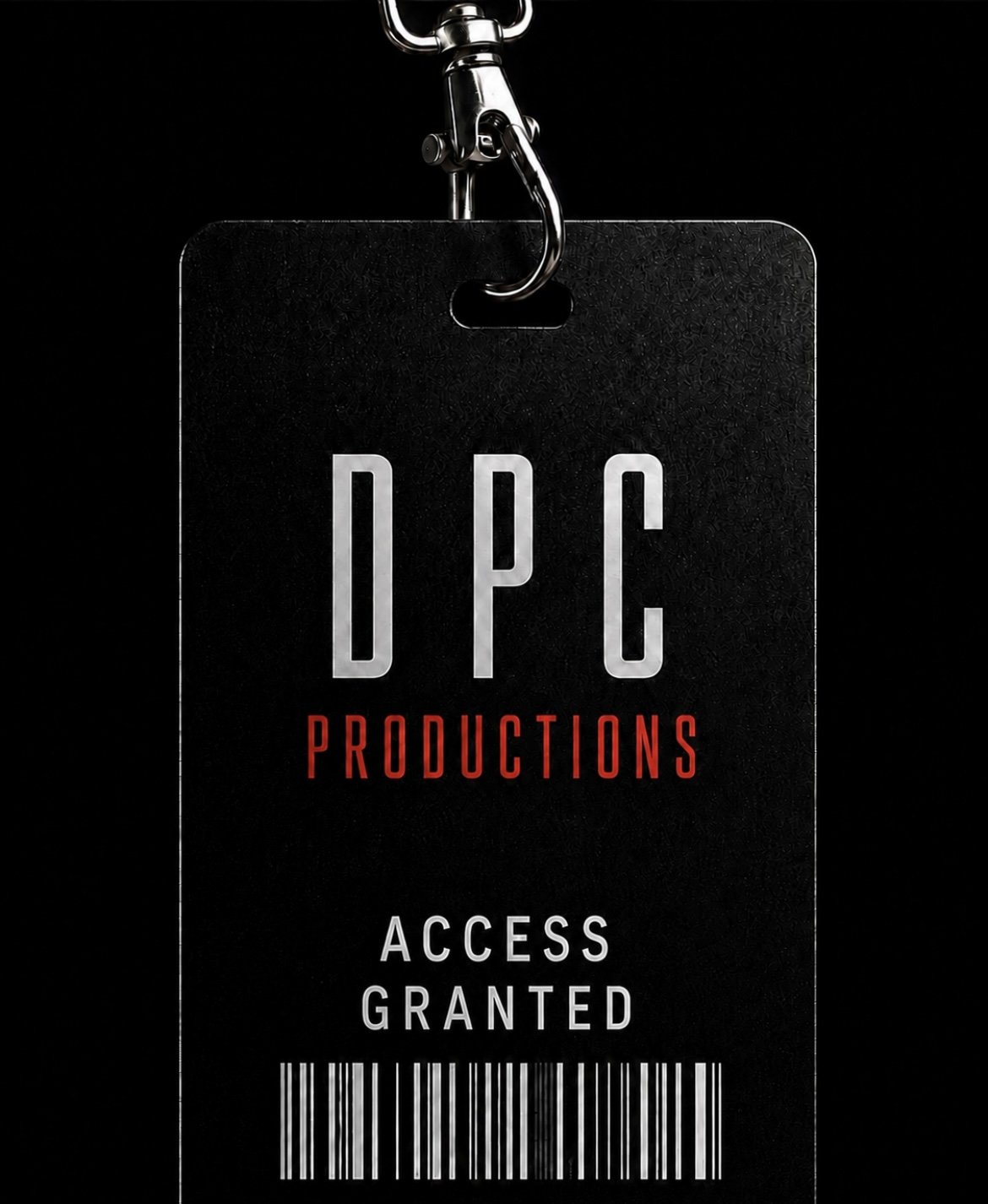 DPC productions official branding logo, for Daniel Paul Calvo's industrial music catalogue SYSTEMS. A black pass with the text 'DPC PRODUCTIONS ACCESS GRANTED' and a barcode, hanging from a metal clip.