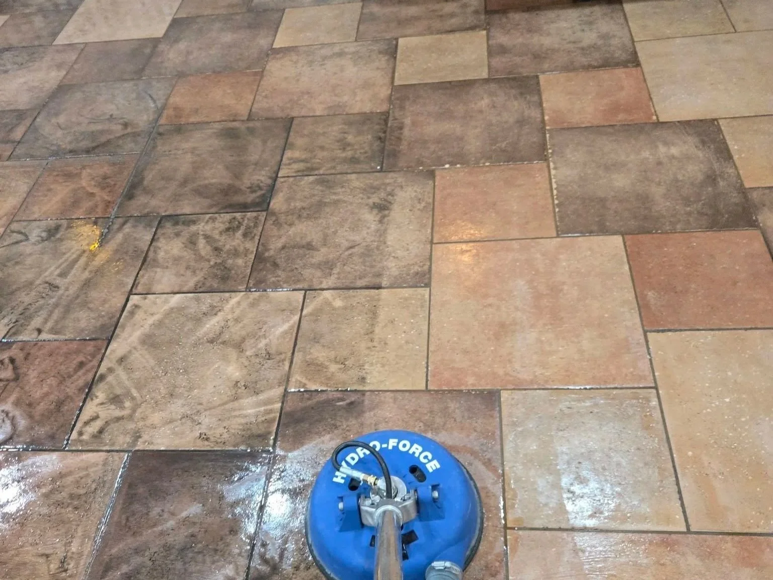 tile cleaning tool showing before and after of tile floor cleaning.