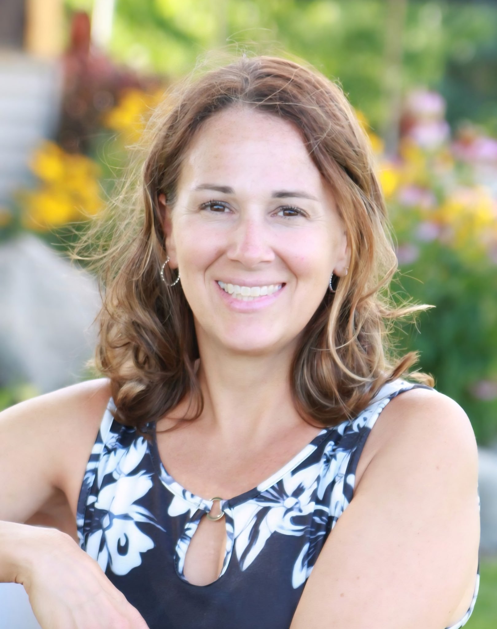 Licensed therapist Kari Trempler, LPC, NCC, specializing in child, teen, and family therapy for anxiety, depression, trauma, and behavioral challenges at St. Charles Wellness in St. Charles, MO.