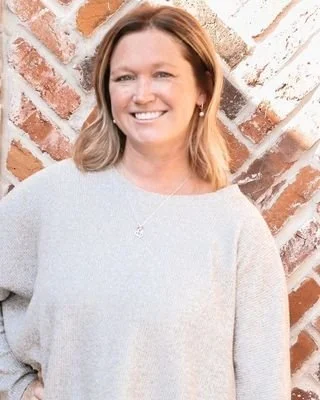 Licensed therapist Jennifer Ostmann, MA, LPC, specializing in evidence‑based therapy for teens and adults navigating anxiety, depression, trauma, women’s health concerns, and major life transitions at St. Charles Wellness in St. Charles, MO.