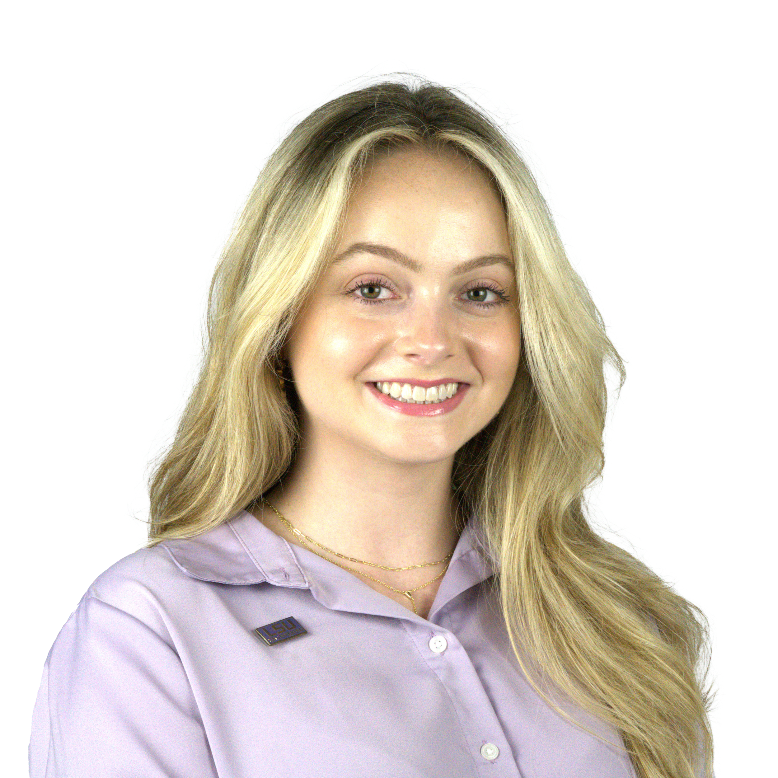 Close-up of a young woman with blonde hair wearing a lavender LSU uniform and smiling.