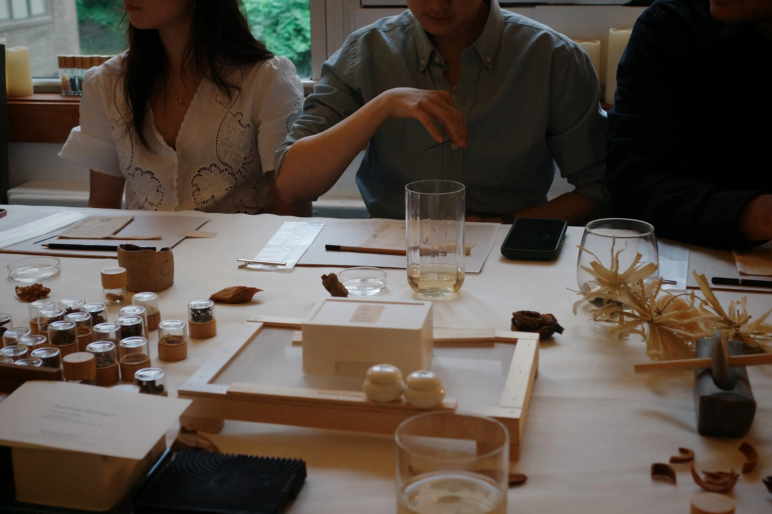 Chinese herbs and natural incense materials prepared for a scent and memory workshop at Oblique Table in New York City.