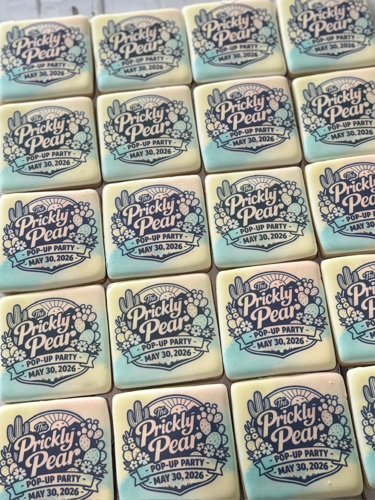 Rows of decorated cookies reading “The Prickly Pear Pop-Up Party — May 30, 2026,” with cactus, fruit, and floral illustrations.