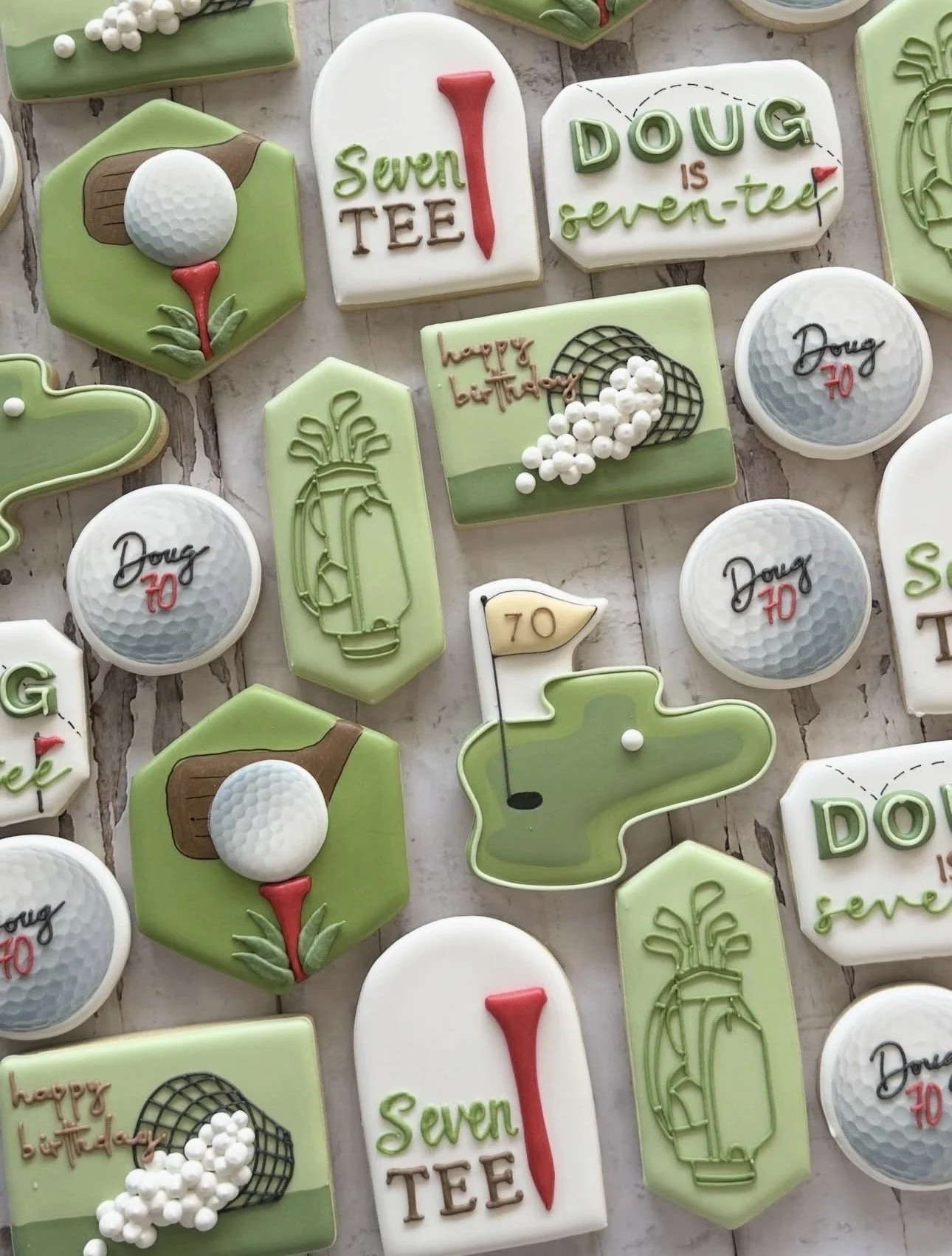 Golf-themed decorated cookies featuring golf balls, clubs, carts, greens, flags, and birthday messages for Doug’s 70th birthday.