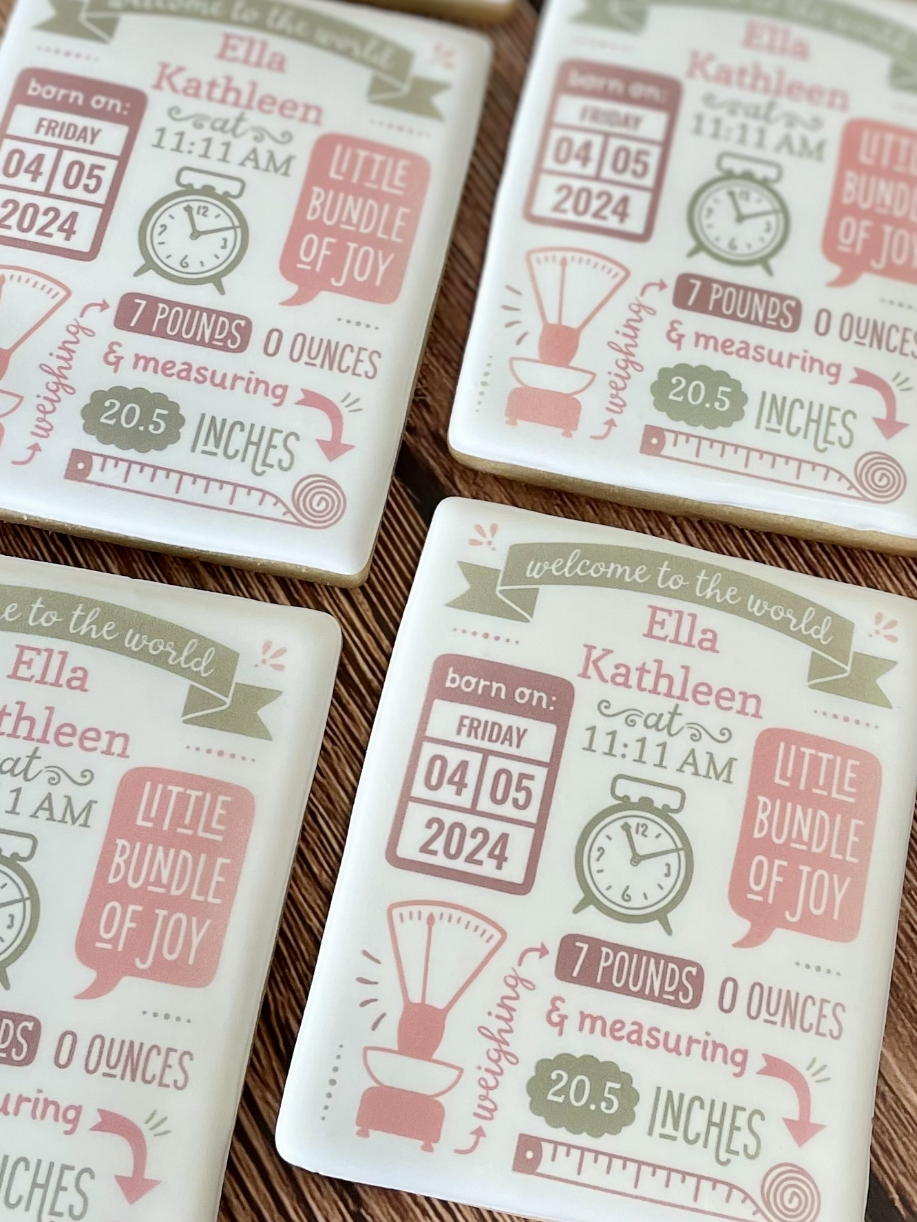 Four personalized birth announcement plaques for Ella Kathleen, featuring birth details, a clock, measuring scale, and the phrase “Little Bundle of Joy.”