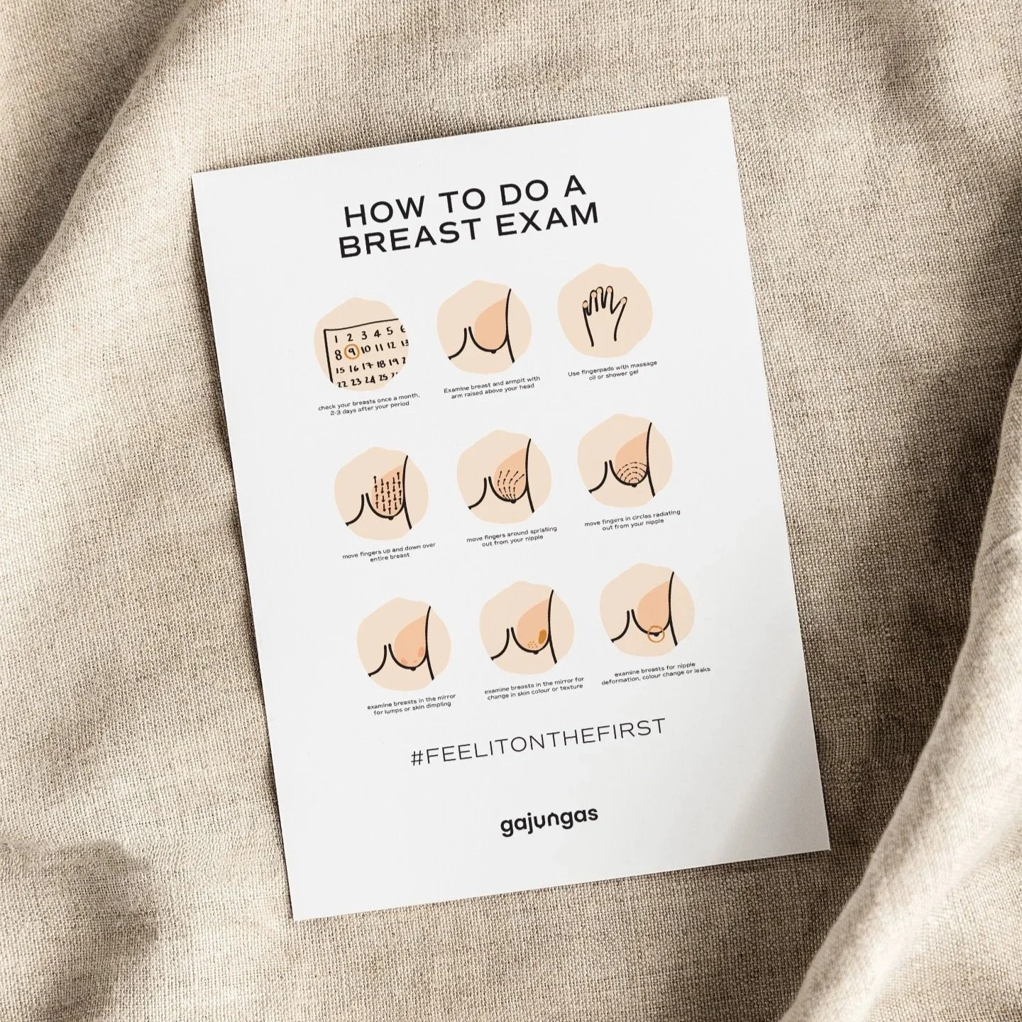 A printed guide on how to do a breast exam, including illustrations and step-by-step instructions, placed on a beige fabric surface.