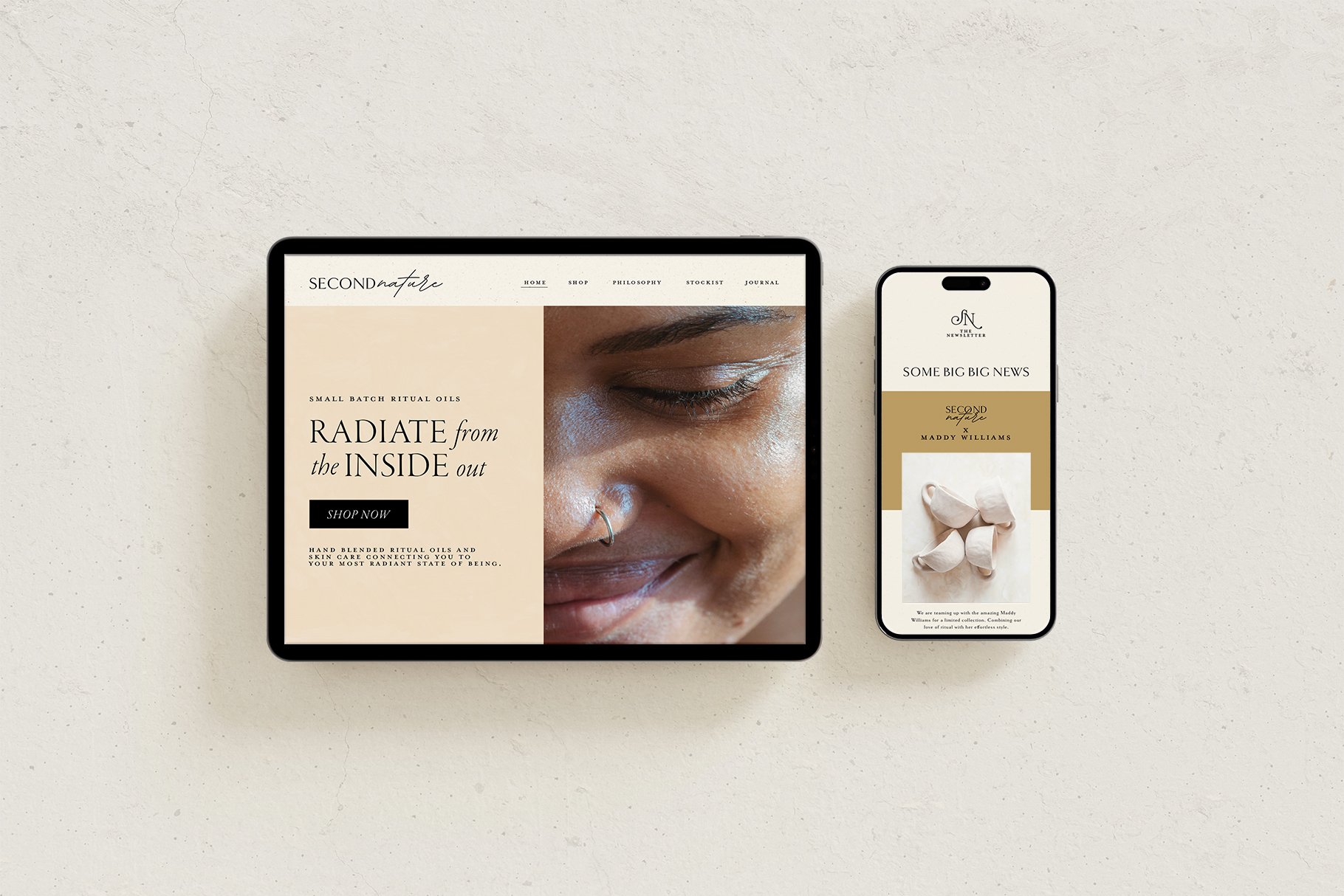 Tablet and smartphone displaying a website and newsletter for Second Nature, focusing on skincare and ritual oils, with a close-up image of a smiling person and white face masks.