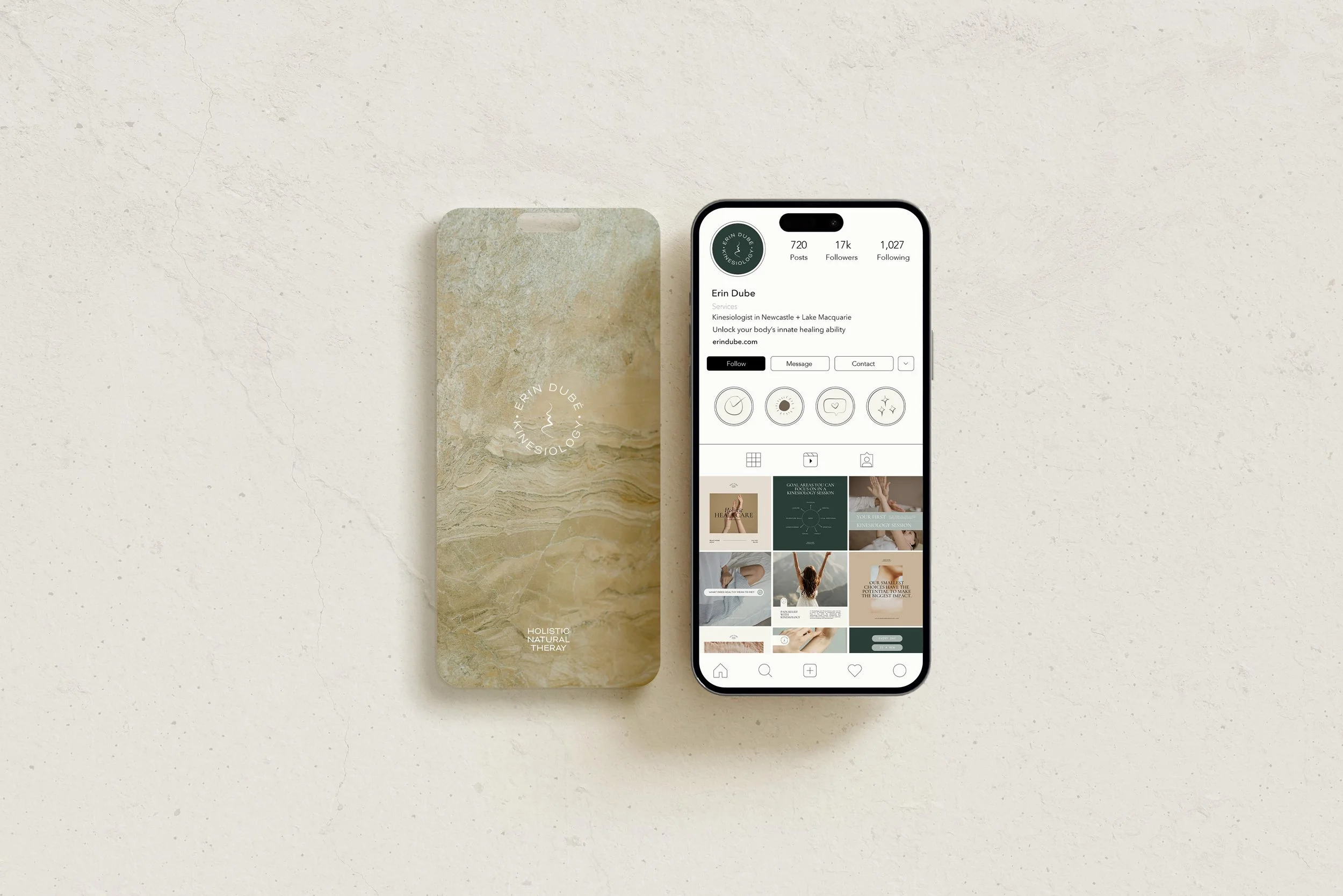 A smartphone displaying an Instagram profile of Erin Dube, a kinesiologist, next to a card with her name and logo. The background is a plain, textured, off-white surface.