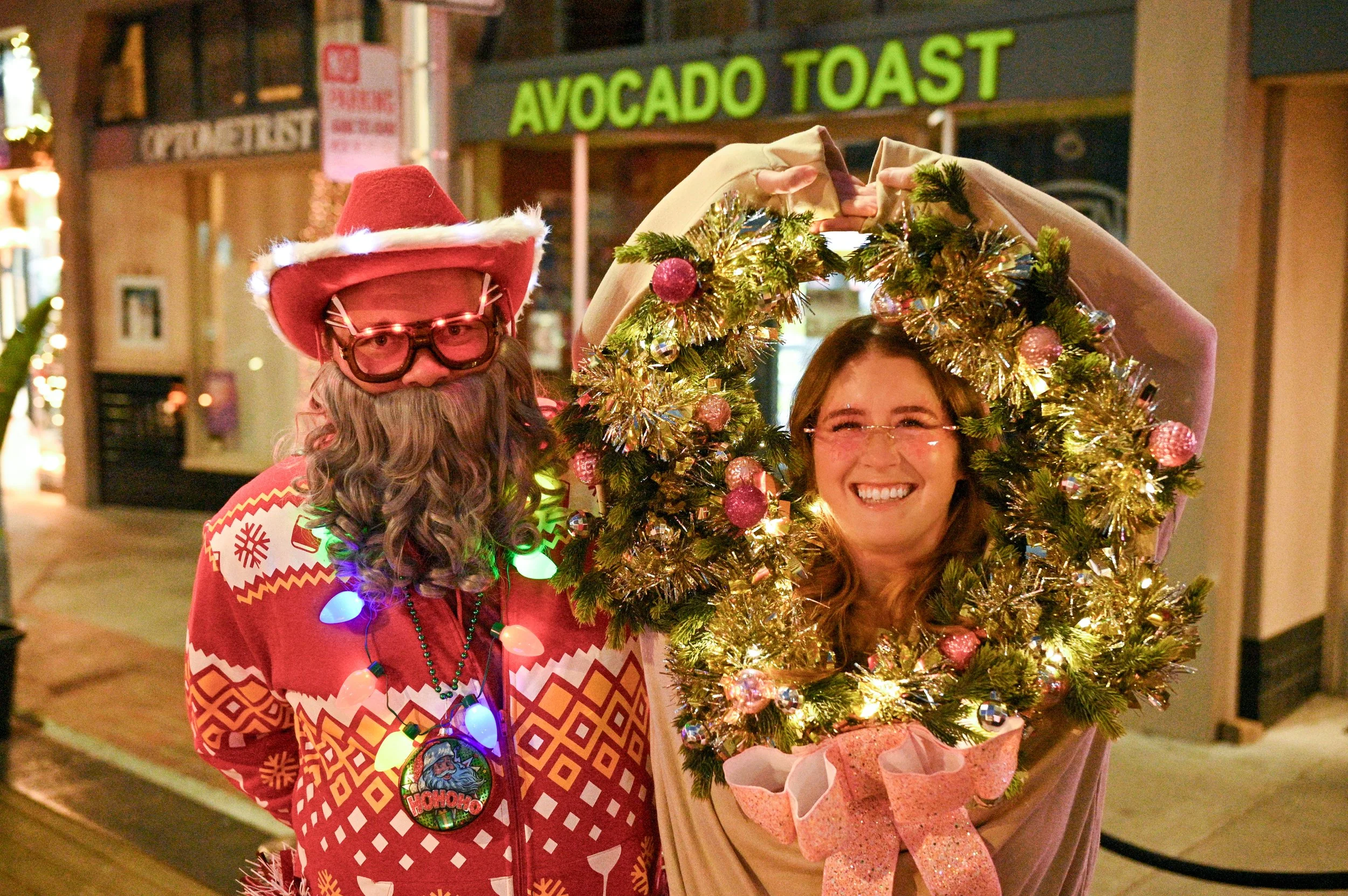Participants in a Santa and wreath costume