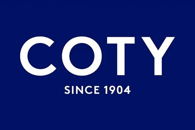 Coty logo with the text 'COTY since 1904' on a dark blue background.