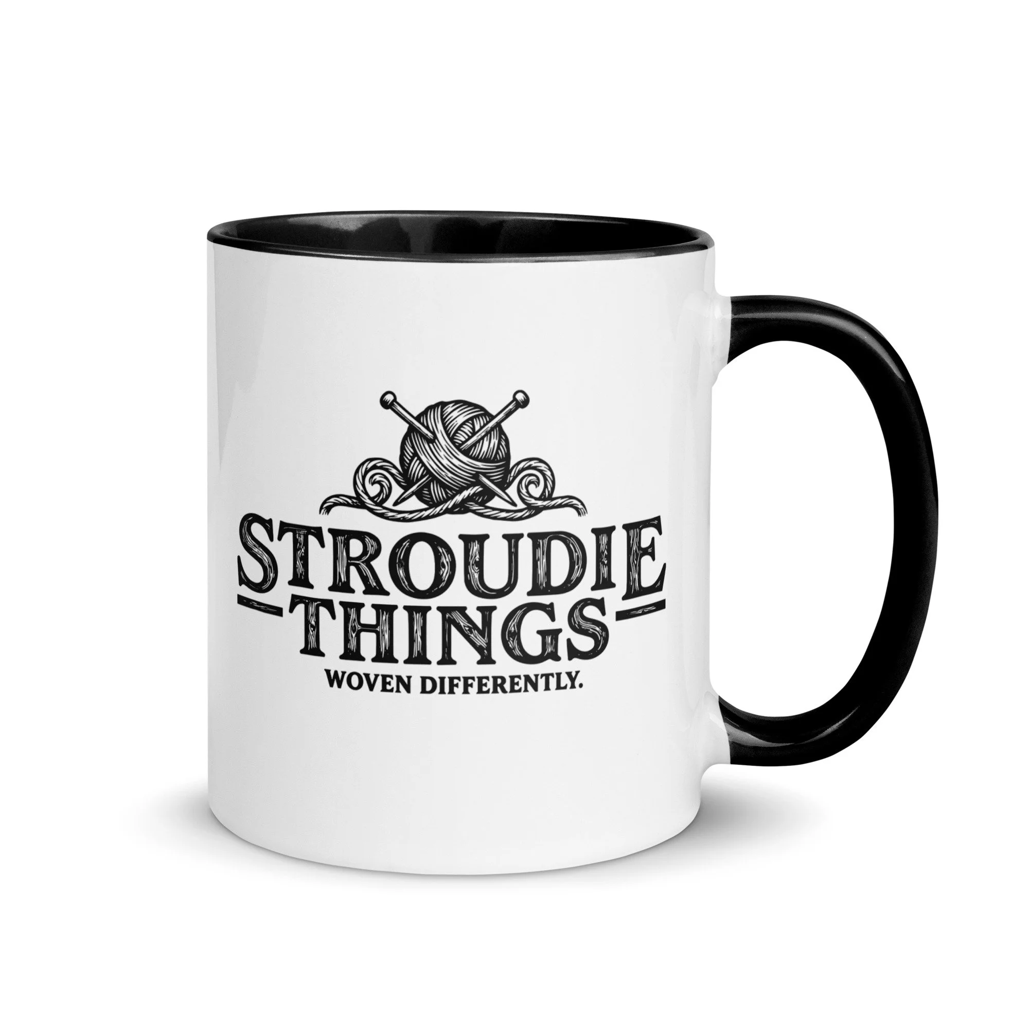 Stroudie Things ceramic mug with black handle featuring knitting needles woodcut illustration