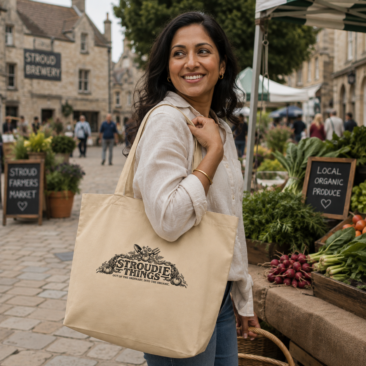stroudie-things-large-organic-tote-bag-woodcut-style-held-by-femaie-shopper