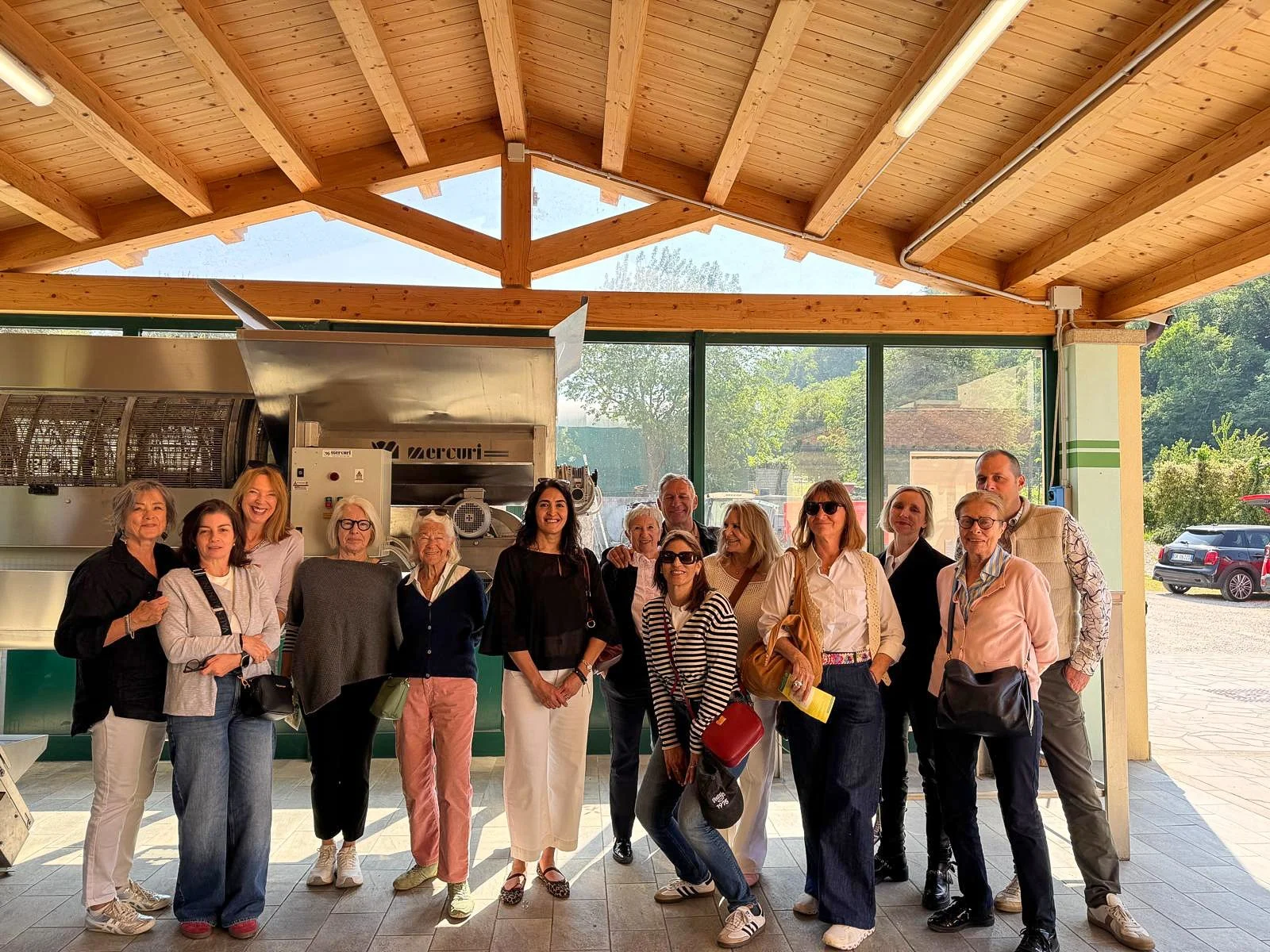 Group of members posing together during an exclusive local tour and special experience.