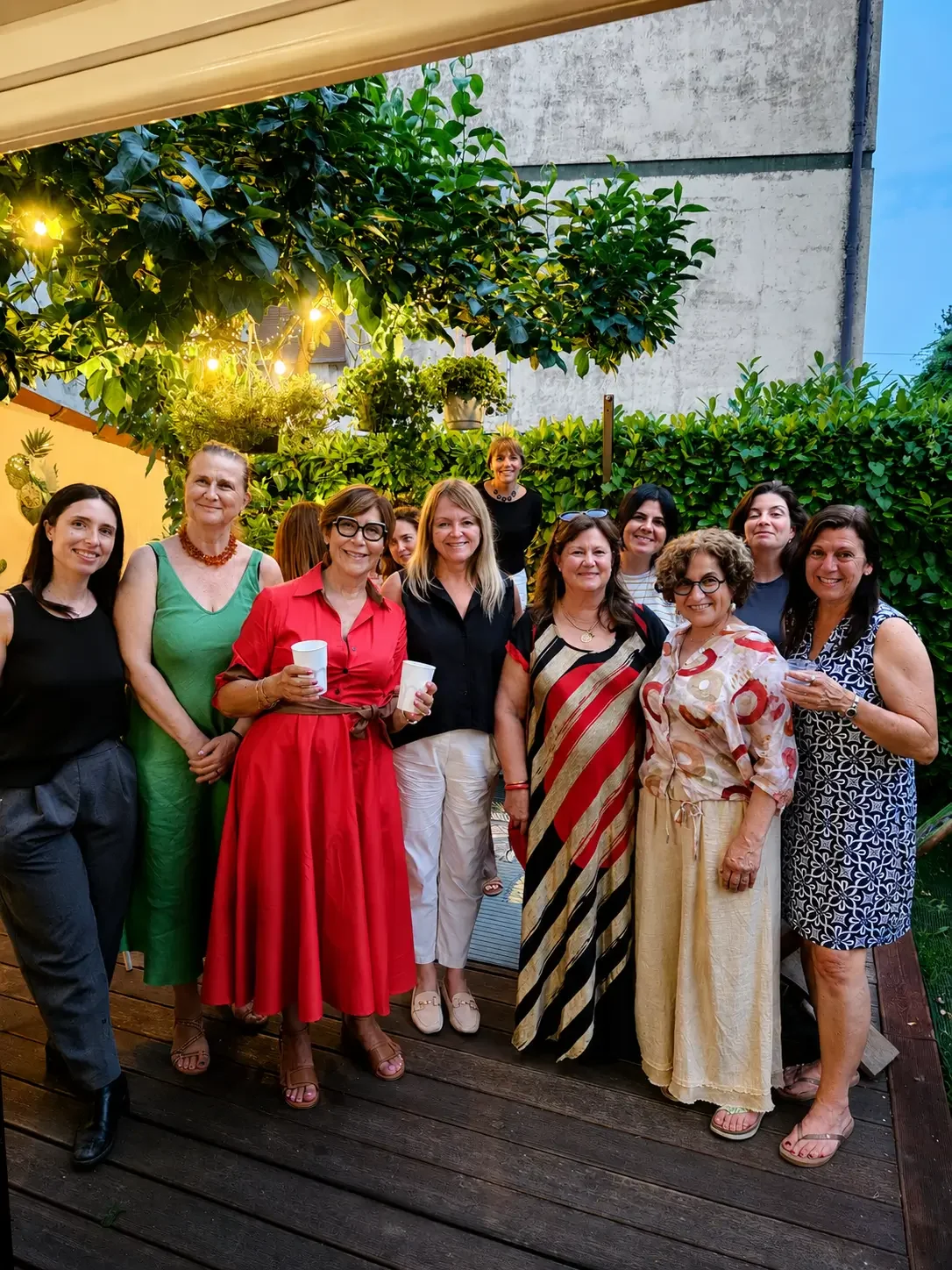 Members of International Ladies Group of Padova enjoying an outdoor evening gathering.