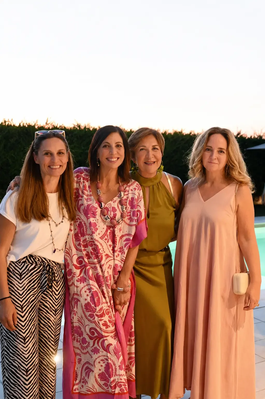 Smiling women attending an International Ladies Group summer evening event in Padova.