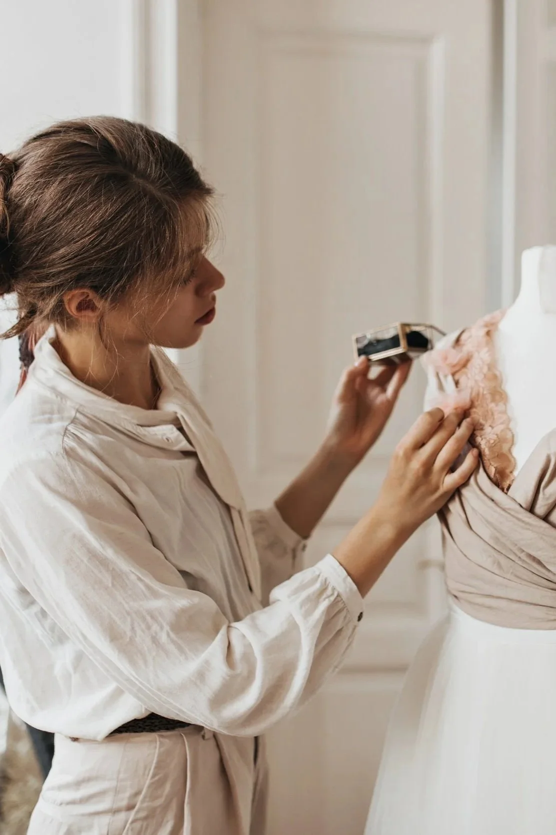 beautiful-lady-beige-outfit-creates-new-dress-brunette-woman-white-shirt-pants-designing-fashionable-outfit.jpg