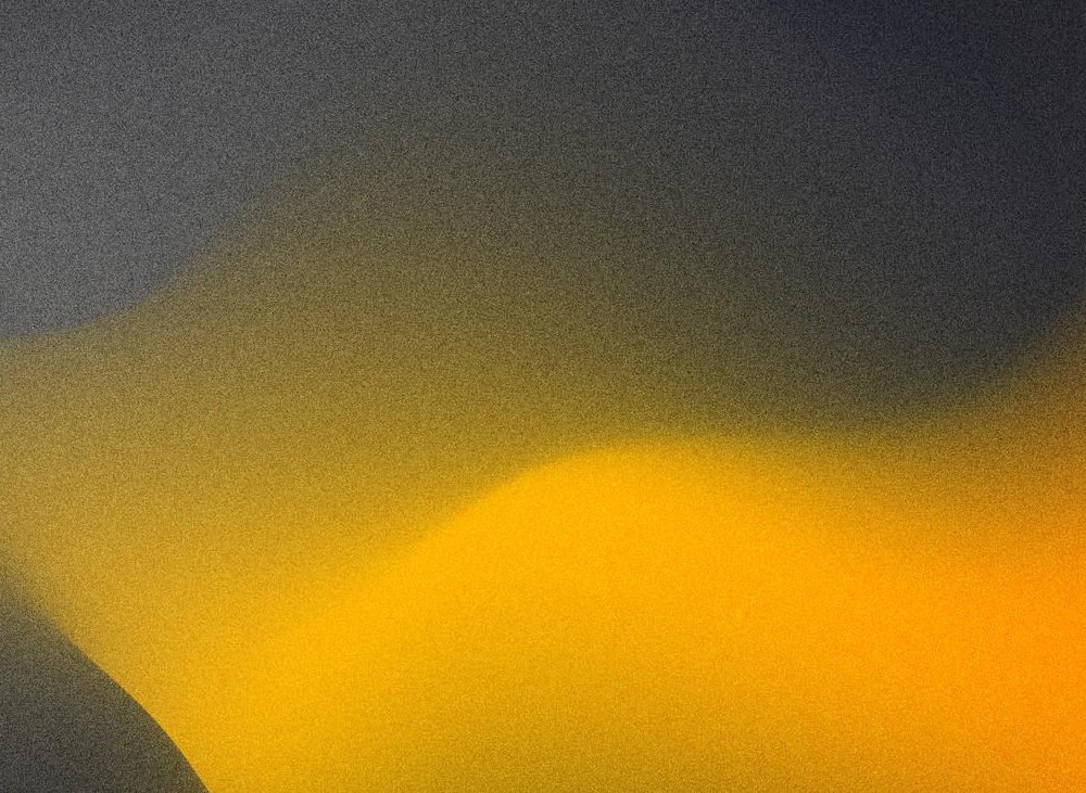 Abstract blurred yellow and dark gray background.